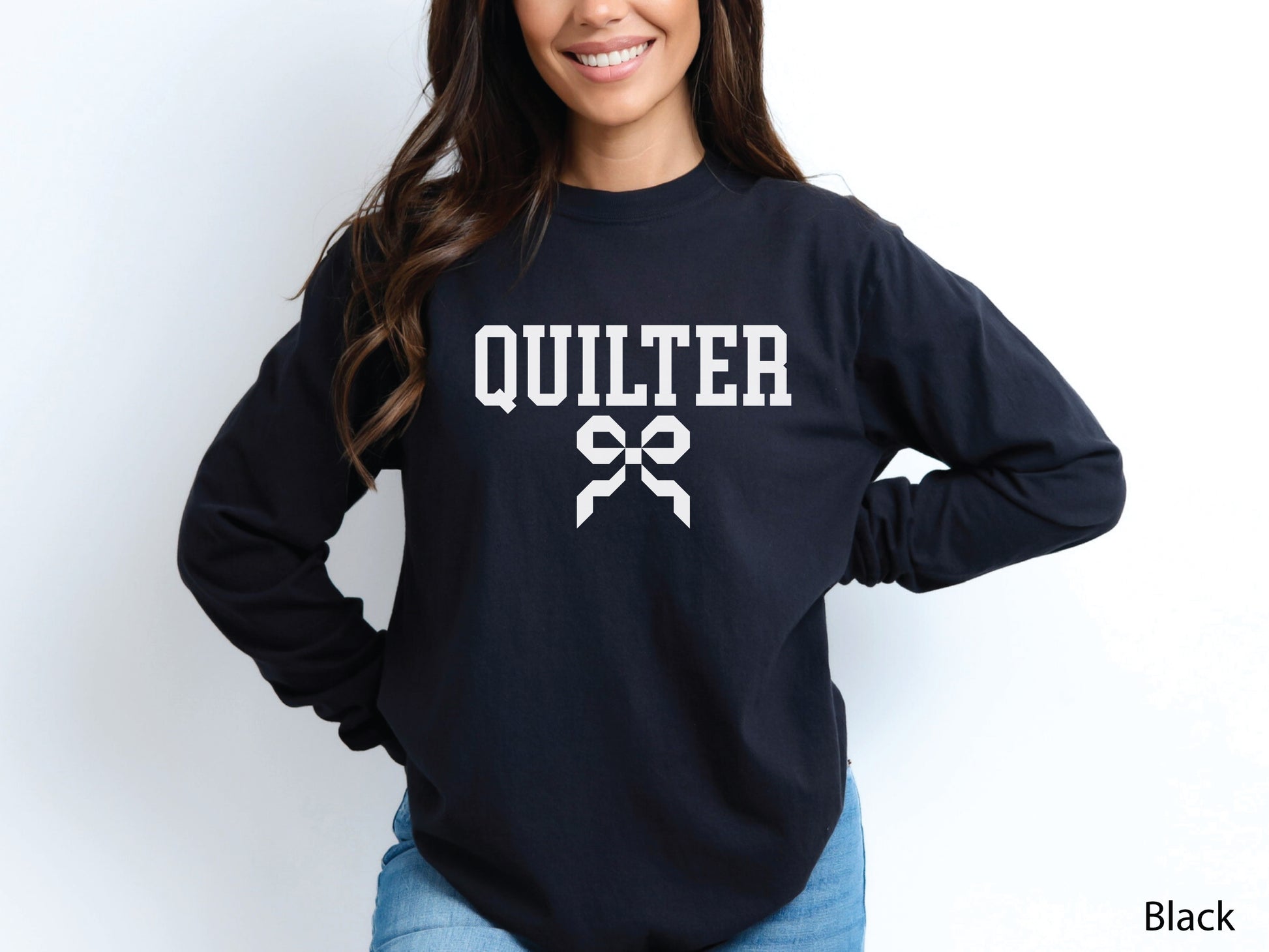 Cozy sweatshirt with bold varsity-style “Quilter” lettering and a coquette bow — perfect for quilt retreats, guild meetings, or as a thoughtful gift for quilters.
