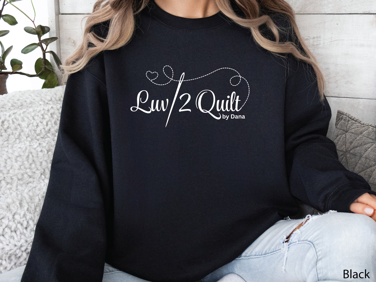 Official Luv2Quilt by Dana quilting-themed sweatshirt featuring the Luv2Quilt logo with a sewing needle and stitched heart design, perfect for quilt classes, retreats, and everyday wear.