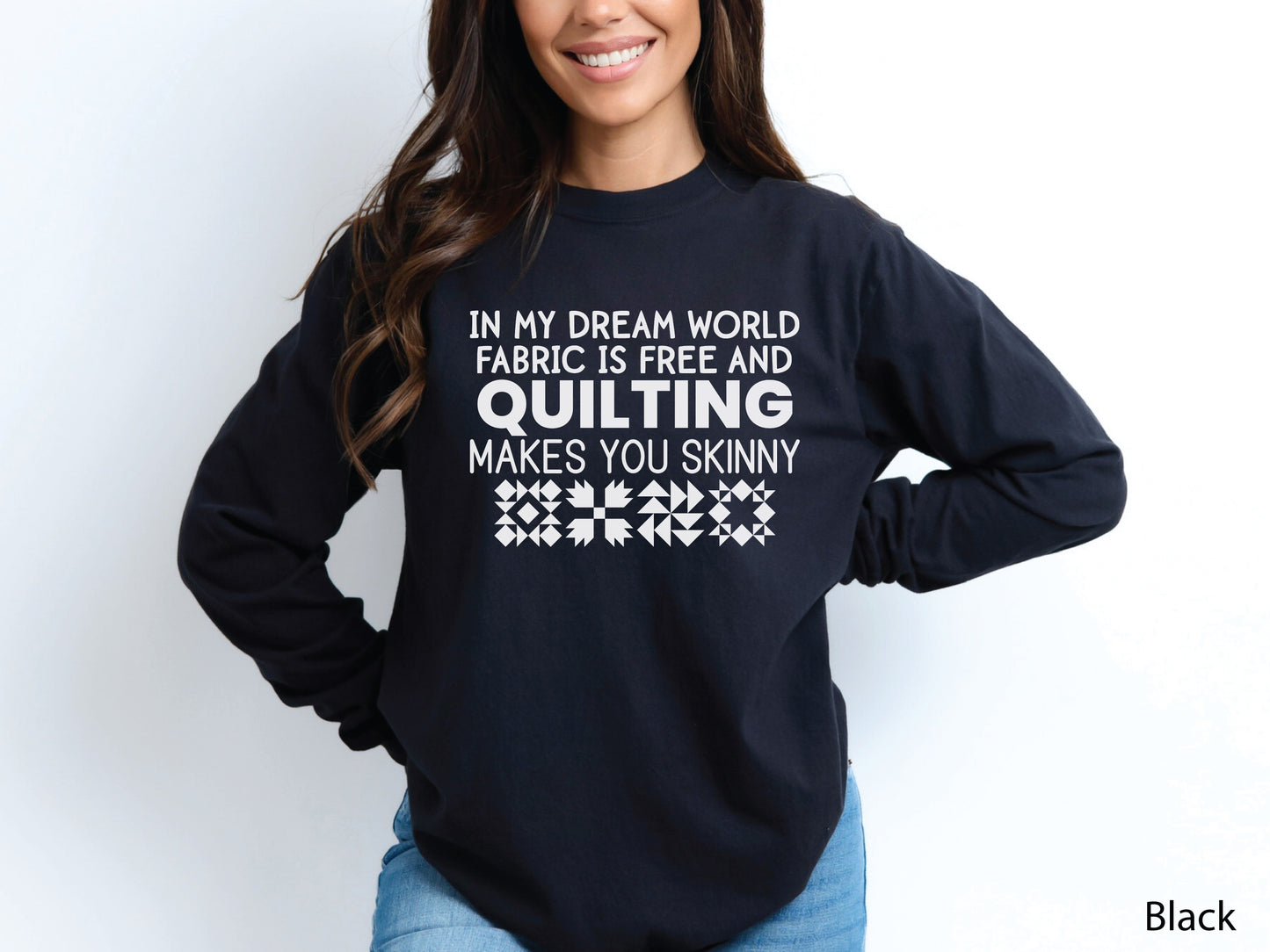 Funny quilter sweatshirt with the phrase “In My Dream World, Fabric Is Free and Quilting Makes You Skinny,” featuring quilt block designs and cozy long sleeves.