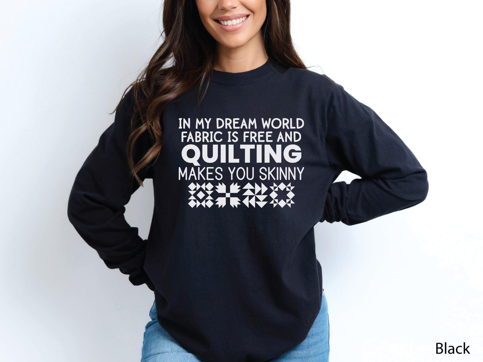 Funny quilter sweatshirt with the phrase “In My Dream World, Fabric Is Free and Quilting Makes You Skinny,” featuring quilt block designs and cozy long sleeves.