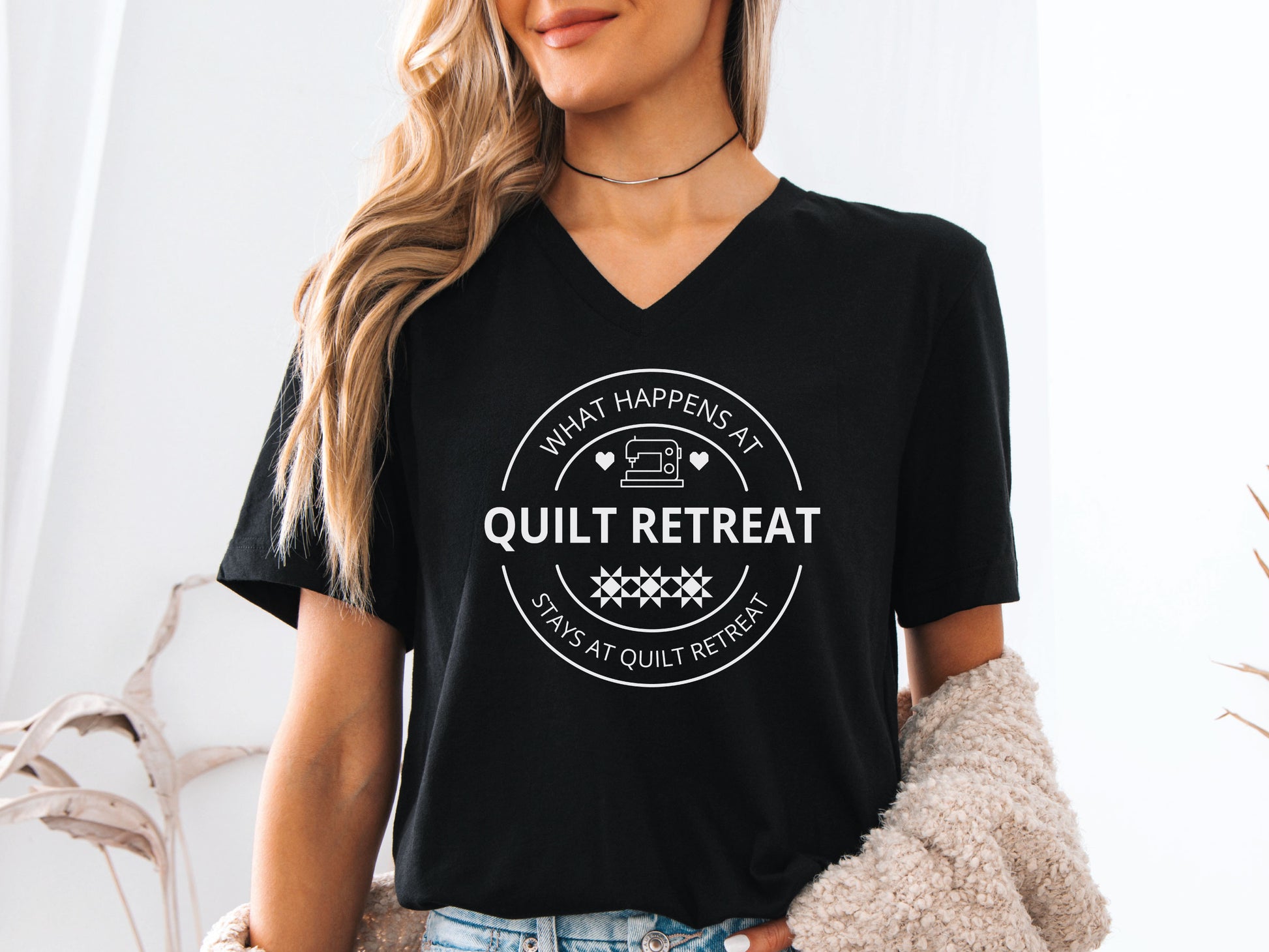What Happens at Quilt Retreat t-shirt in black, fun quilting-themed gift for quilters and stitching crews. Black Bella V-Neck Shirt.