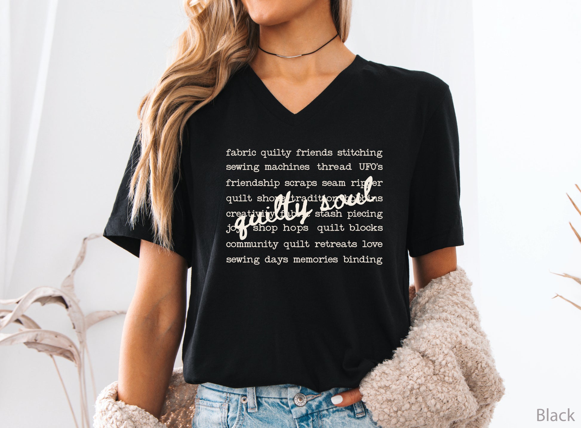 Vintage-inspired Quilty Soul t-shirt featuring a typewriter-style mix of quilting words with flowing handwritten script, perfect for quilters, everyday wear, quilt retreats, Halloween, and spooky season.
