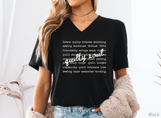 Vintage-inspired Quilty Soul t-shirt featuring a typewriter-style mix of quilting words with flowing handwritten script, perfect for quilters, everyday wear, quilt retreats, Halloween, and spooky season.