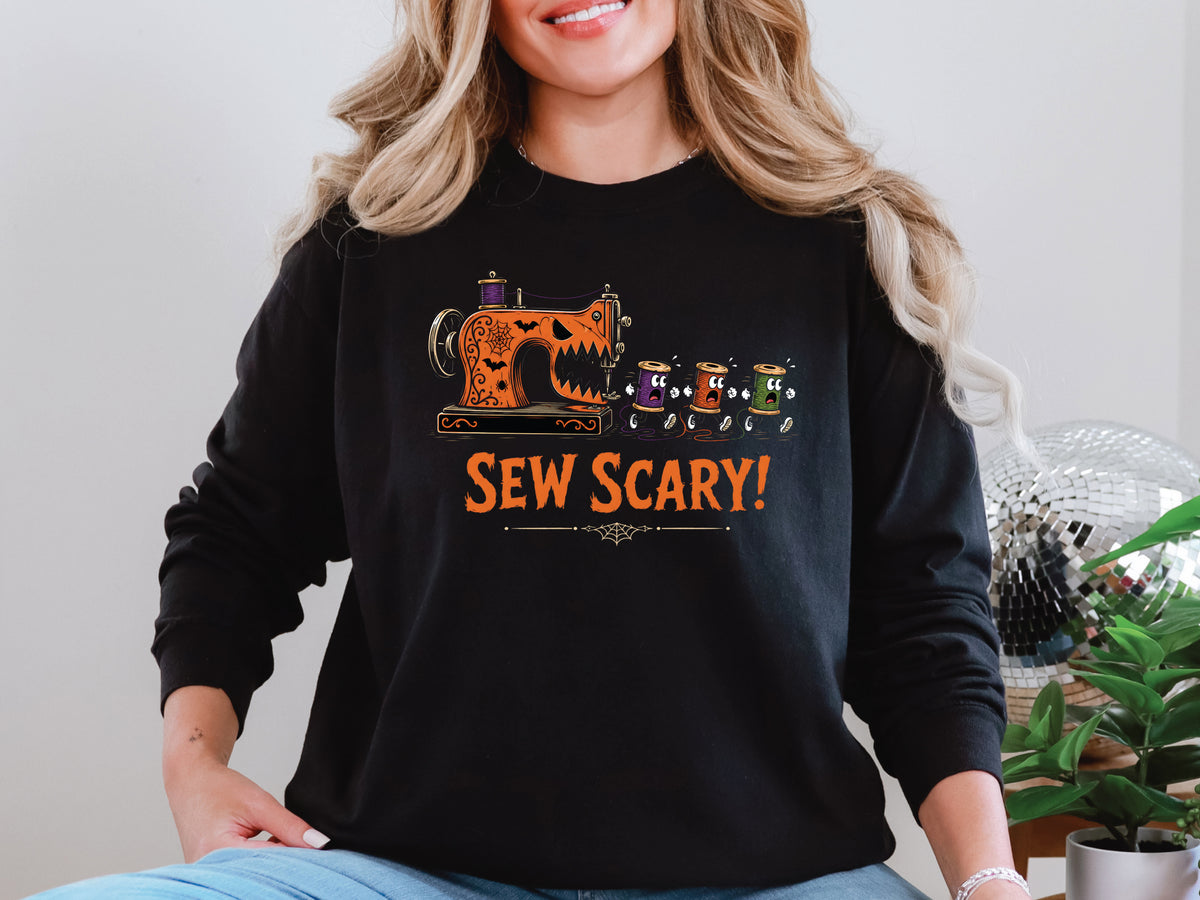 Sew Scary Halloween T-shirt with a vintage sewing machine monster chasing colorful thread spools, surrounded by bats and spiderwebs.