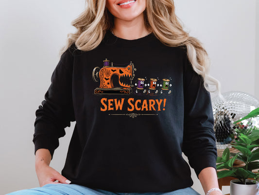 Sew Scary Halloween T-shirt with a vintage sewing machine monster chasing colorful thread spools, surrounded by bats and spiderwebs.