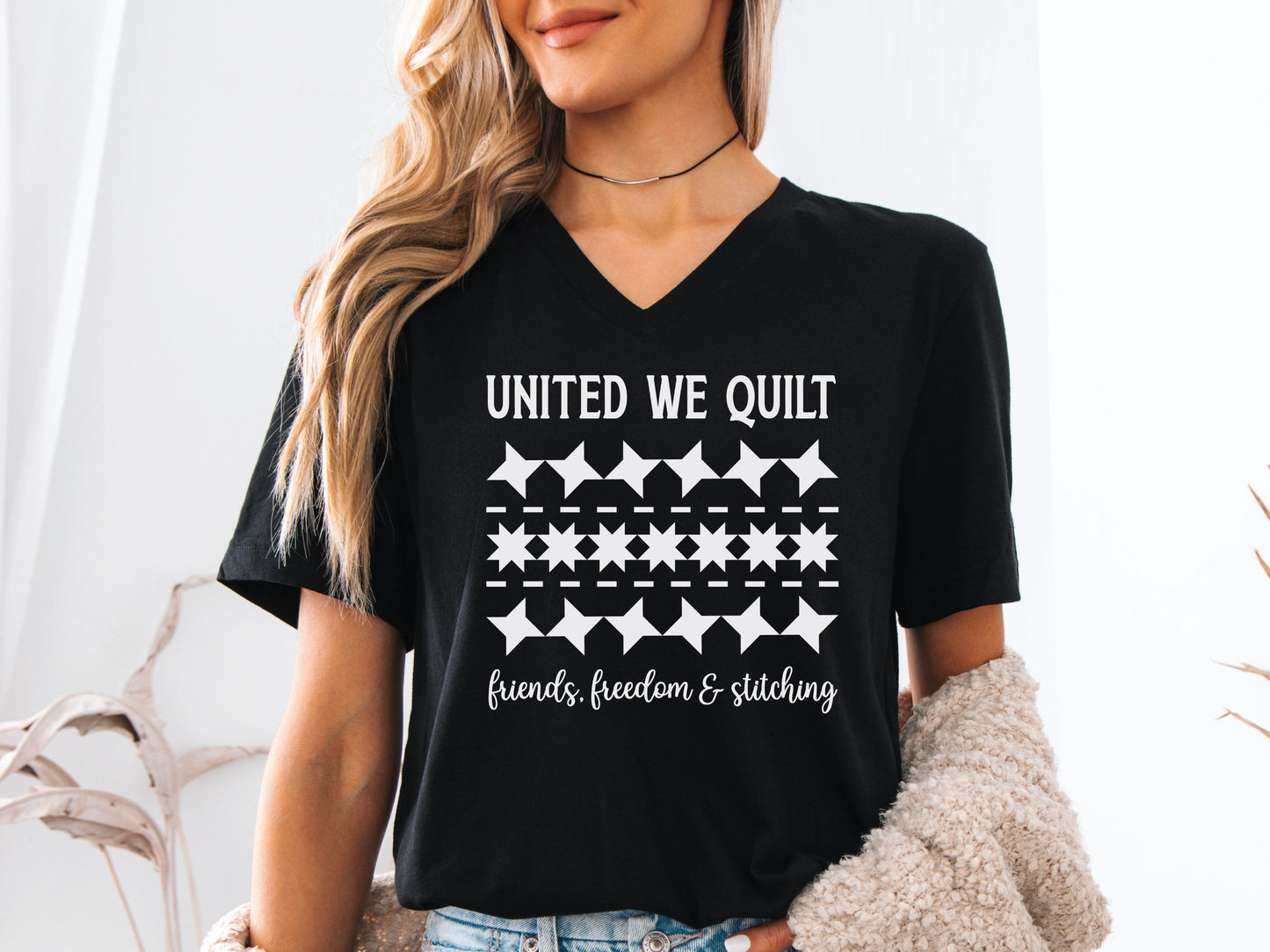 United We Quilt t-shirt with rows of friendship quilt blocks and the phrase Friends, Freedom & Stitching, a fun patriotic shirt for quilters and sewists.