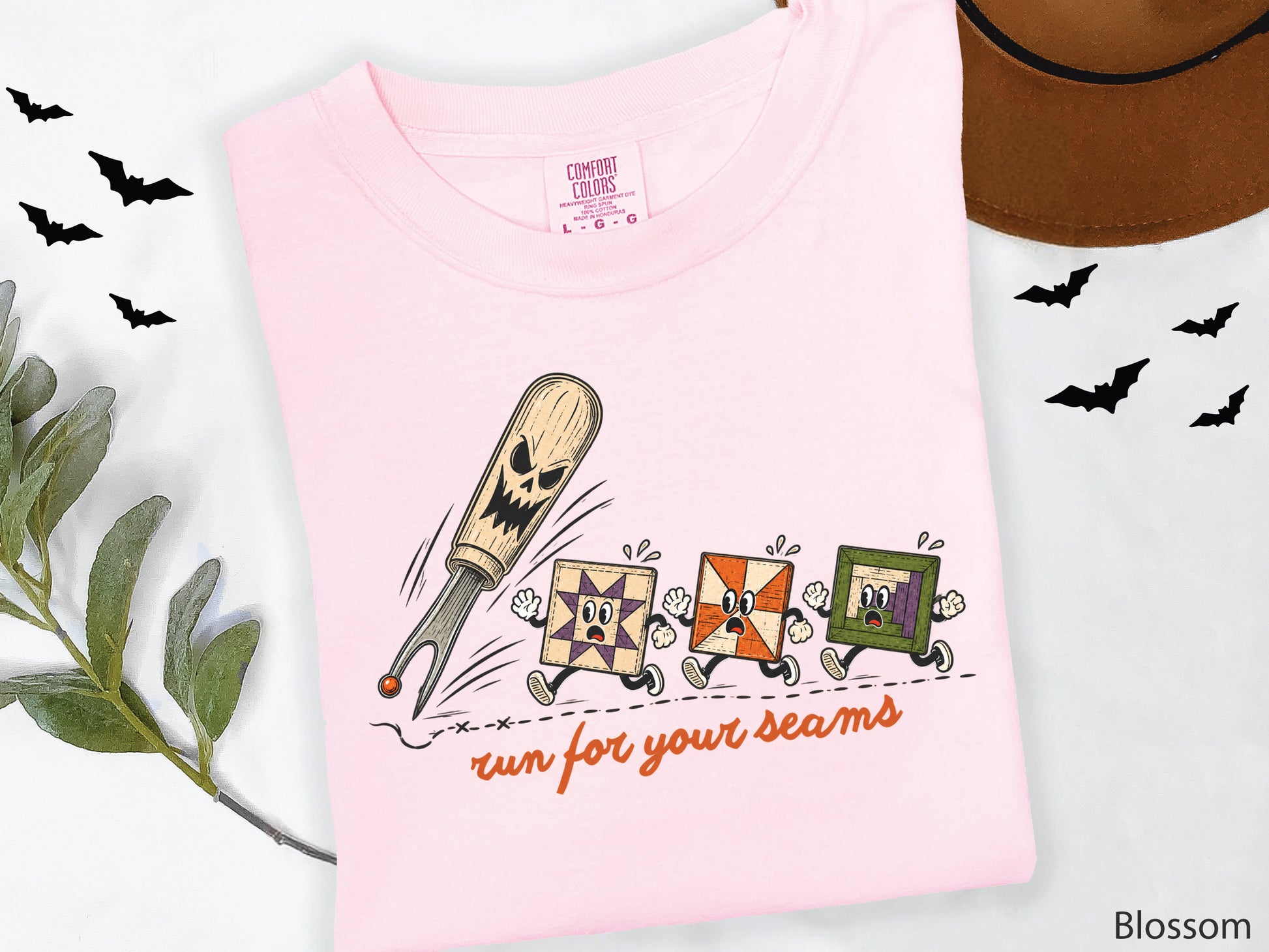 Run for Your Seams Halloween quilting design featuring a spooky seam ripper chasing three frightened colorful quilt blocks in a vintage-inspired style.