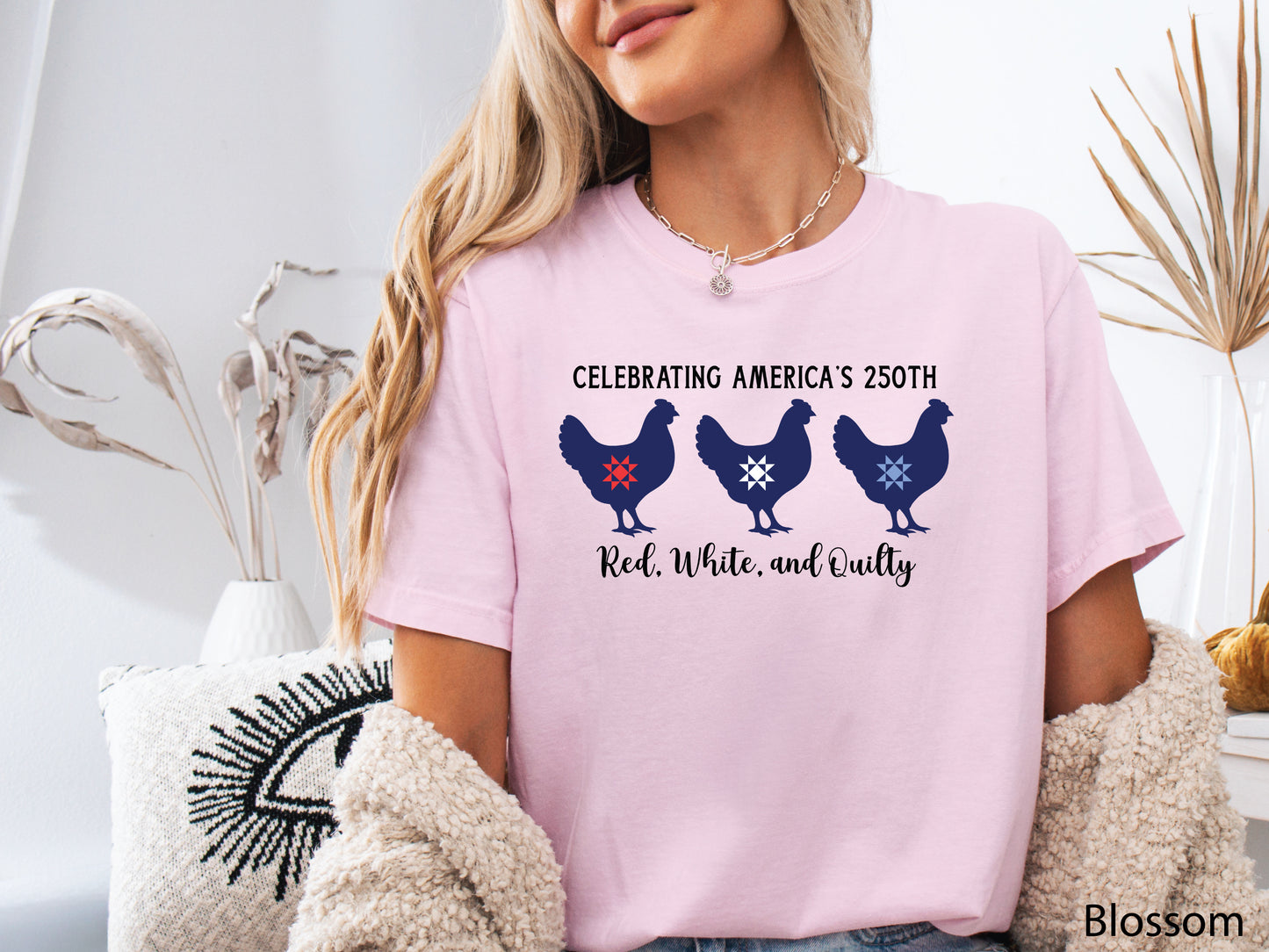Patriotic quilting t-shirt with three chickens featuring red, white, and blue quilt star blocks and the phrase “Celebrating America’s 250th – Red, White, and Quilty.”