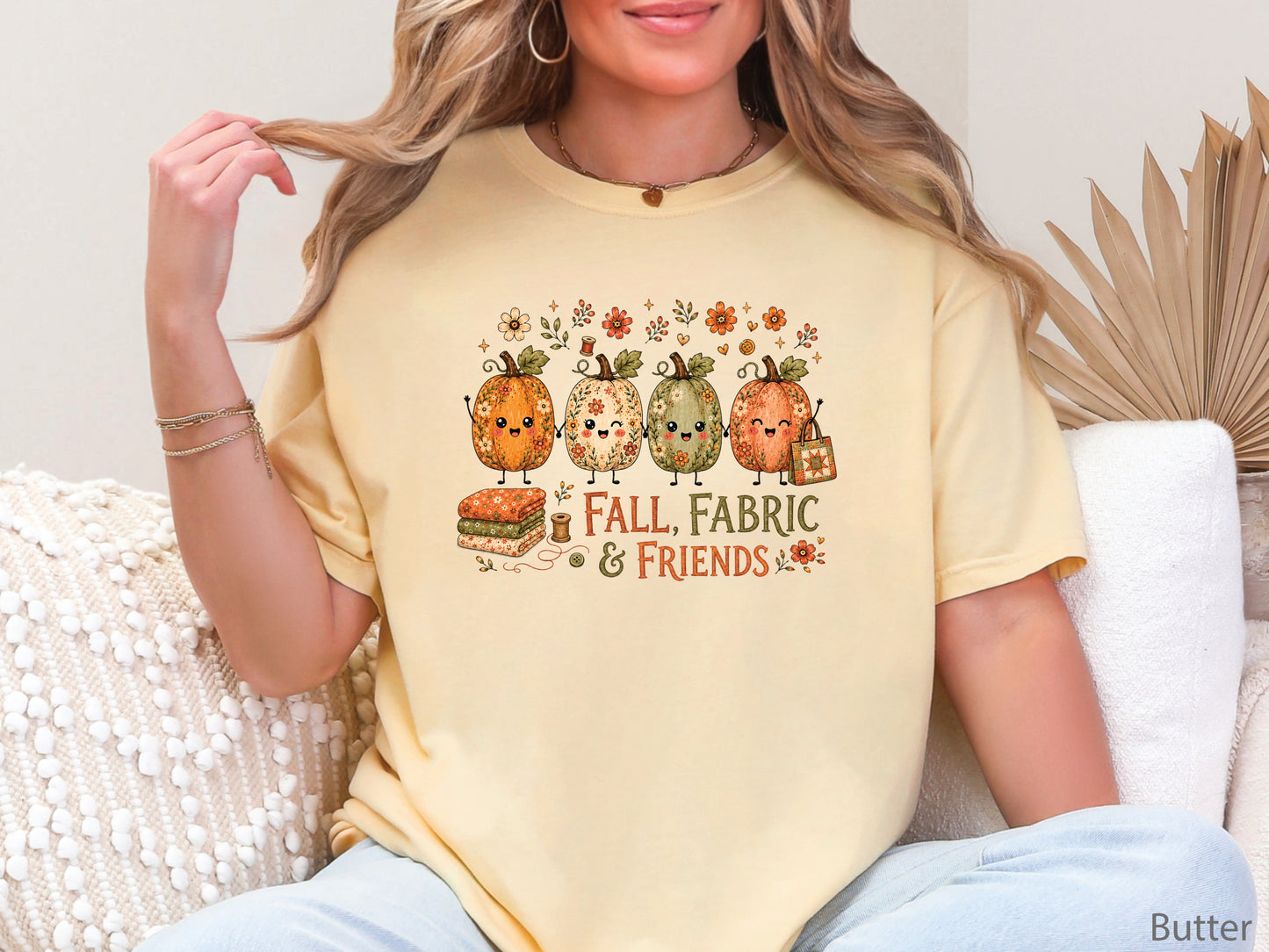 Fall, Fabric & Friends quilting t-shirt featuring four whimsical floral pumpkins, folded fabric, sewing notions, fall flowers, and a patchwork quilt tote.
