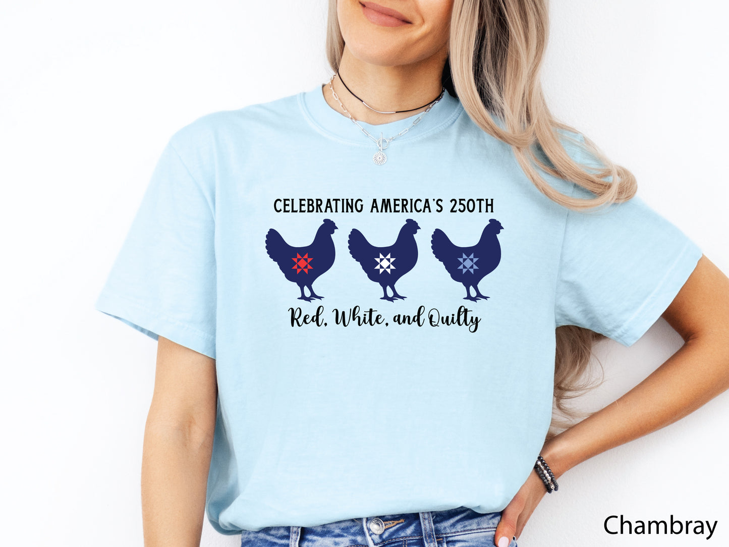 Patriotic quilting t-shirt with three chickens featuring red, white, and blue quilt star blocks and the phrase “Celebrating America’s 250th – Red, White, and Quilty.”