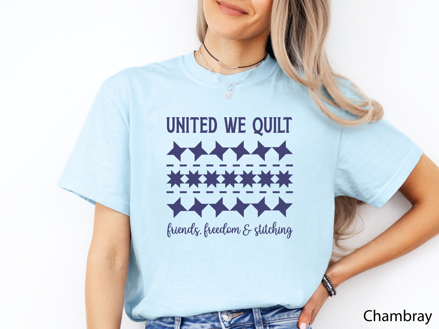 United We Quilt t-shirt with rows of friendship quilt blocks and the phrase Friends, Freedom & Stitching, a fun patriotic shirt for quilters and sewists.