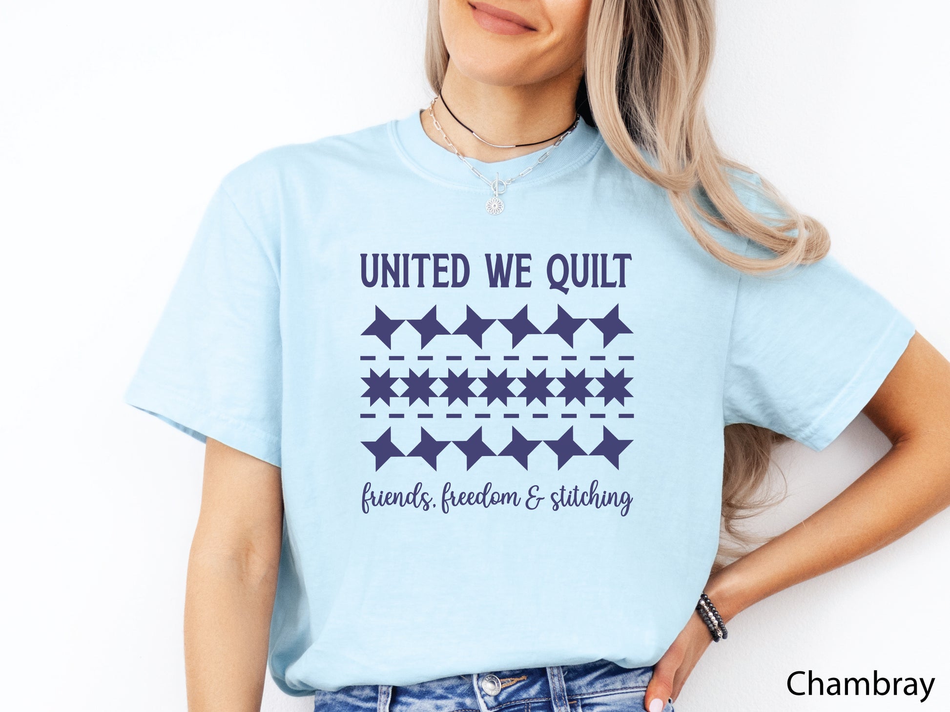 United We Quilt t-shirt with rows of friendship quilt blocks and the phrase Friends, Freedom & Stitching, a fun patriotic shirt for quilters and sewists.