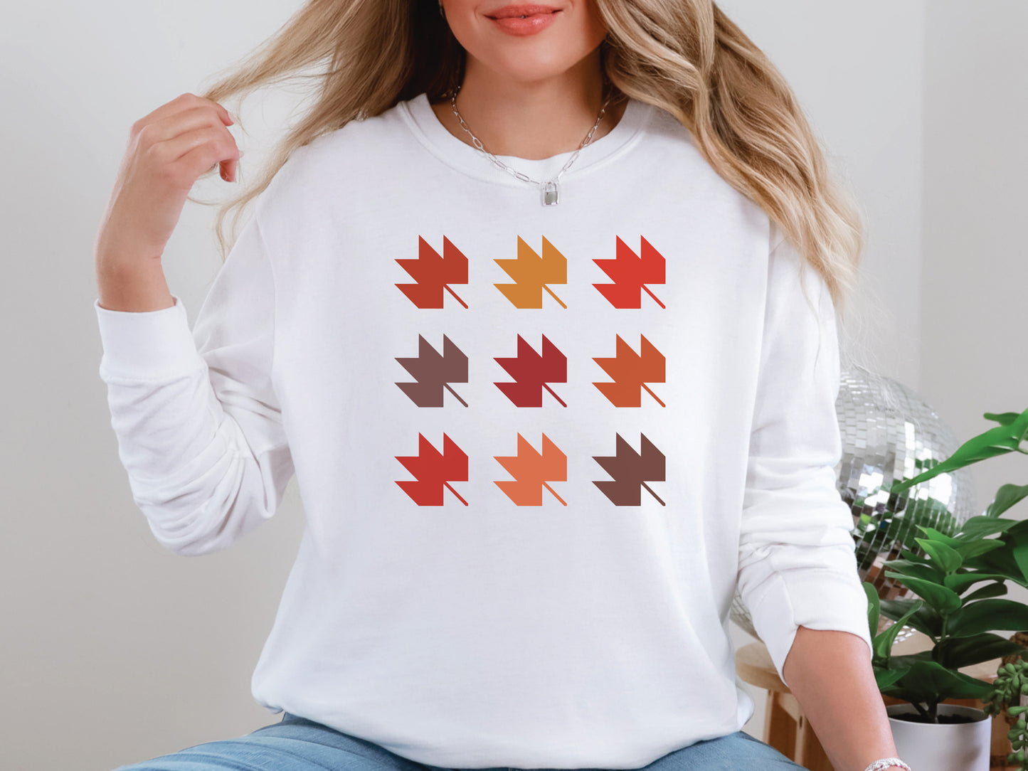 Cozy fall quilting long sleeve shirt in White by Bee Inspired Tees with maple leaf quilt block grid design. Perfect for quilt retreats and gifts for quilters.