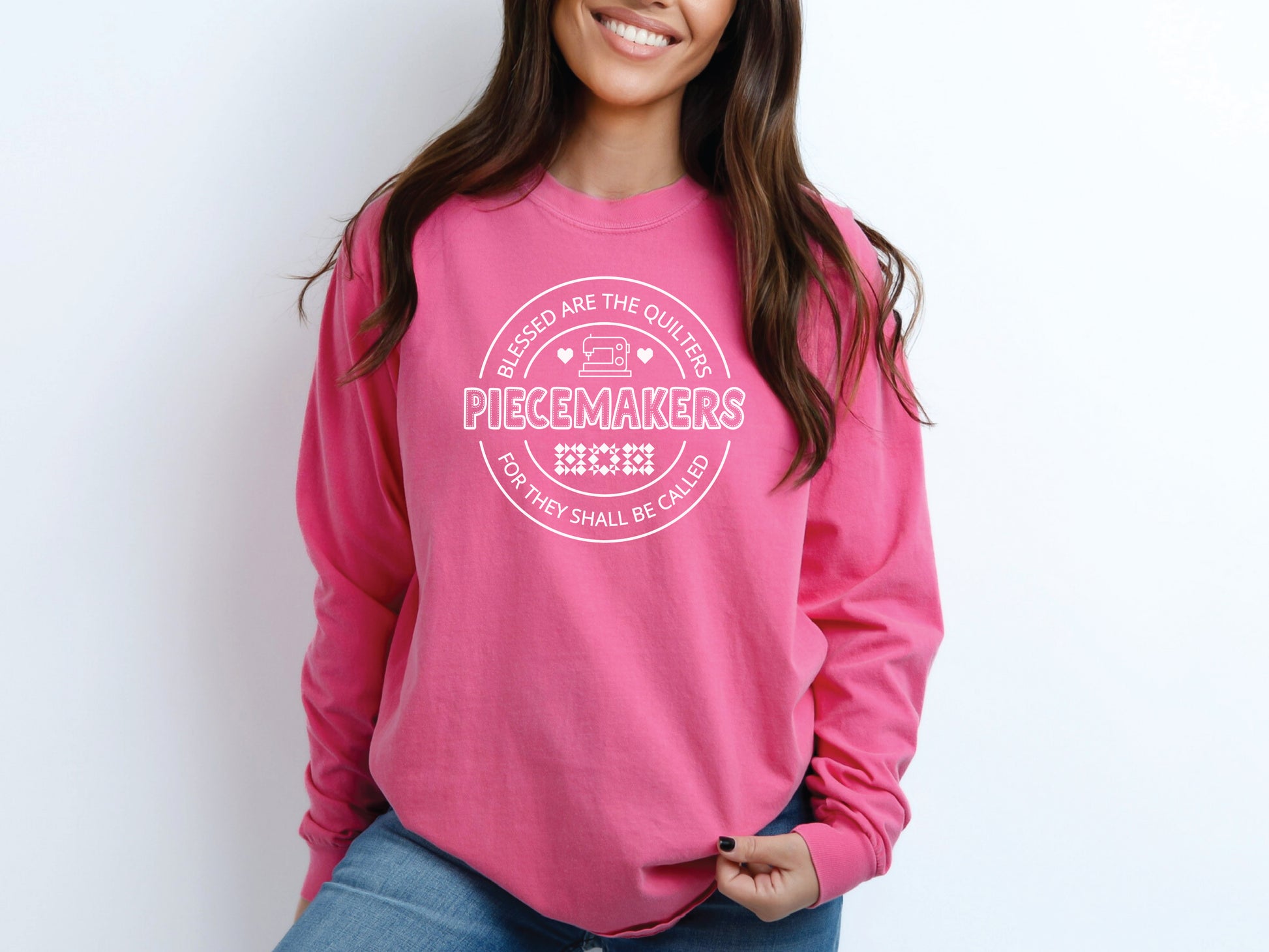 A long-sleeve quilting t-shirt from Bee Inspired Tees featuring the phrase “Piecemaker – Quilters Are Blessed,” celebrating creativity, faith, and the art of quilting; a cozy gift for quilters and perfect for retreats or sewing days.