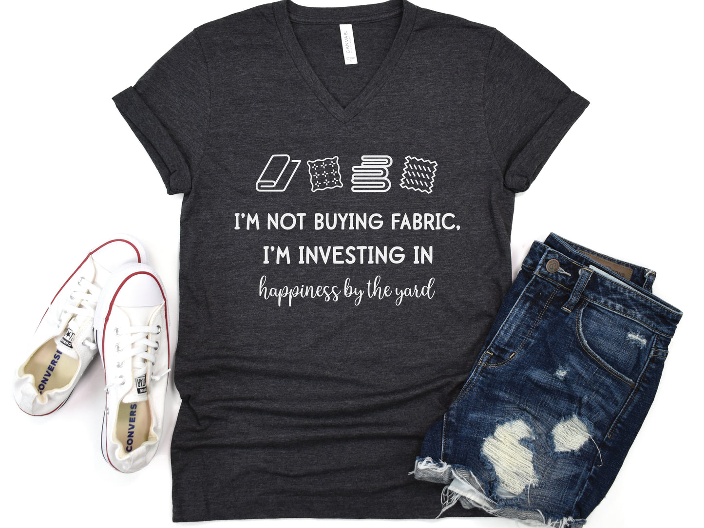 Sewing-themed V-neck t-shirt with the phrase “I’m Not Buying Fabric, I’m Investing in Happiness by the Yard,” perfect for sewists and fabric lovers.