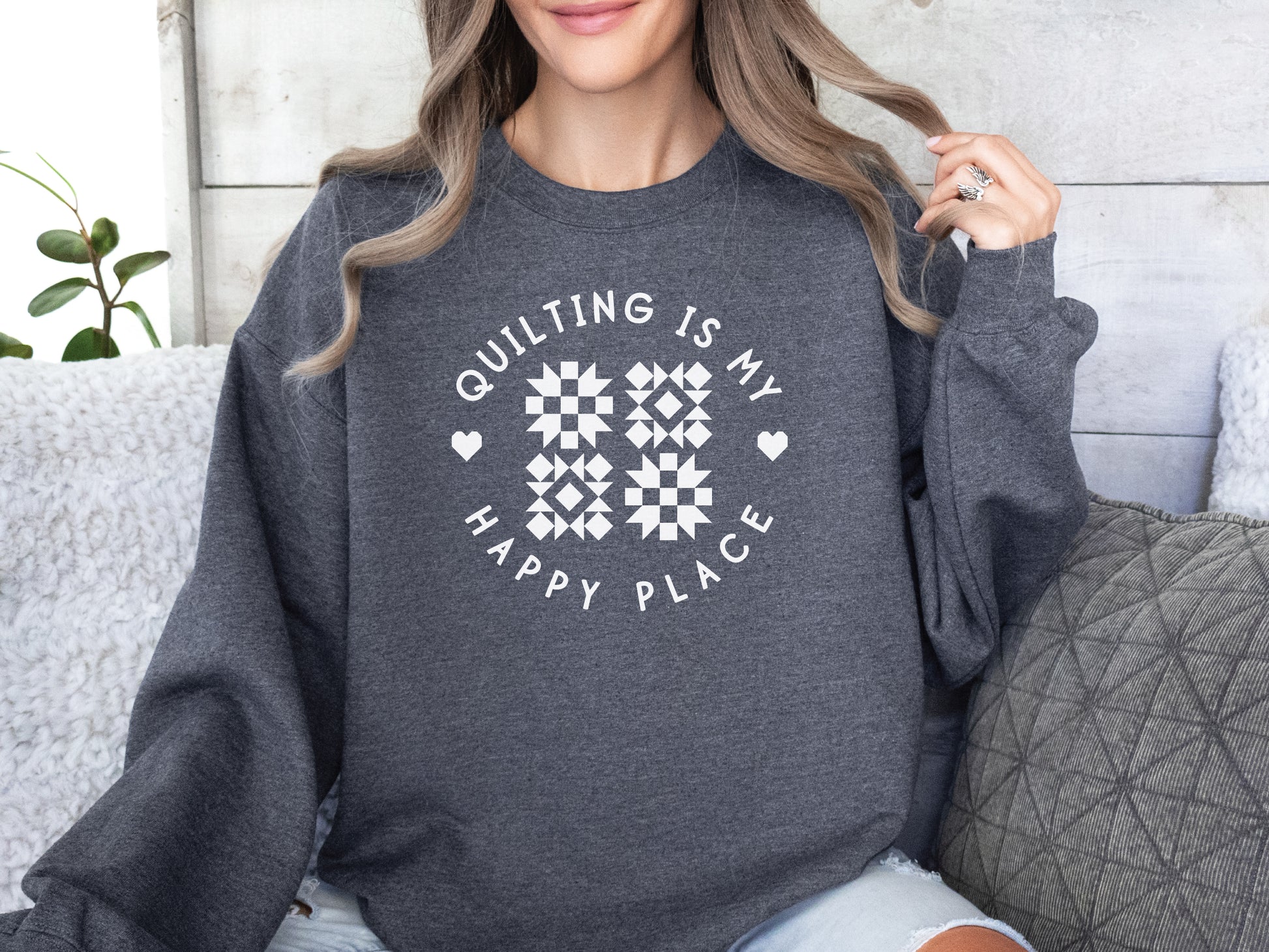Cozy unisex sweatshirt with the phrase “Quilting Is My Happy Place” printed on the front — perfect for quilters and sewists who love to create.