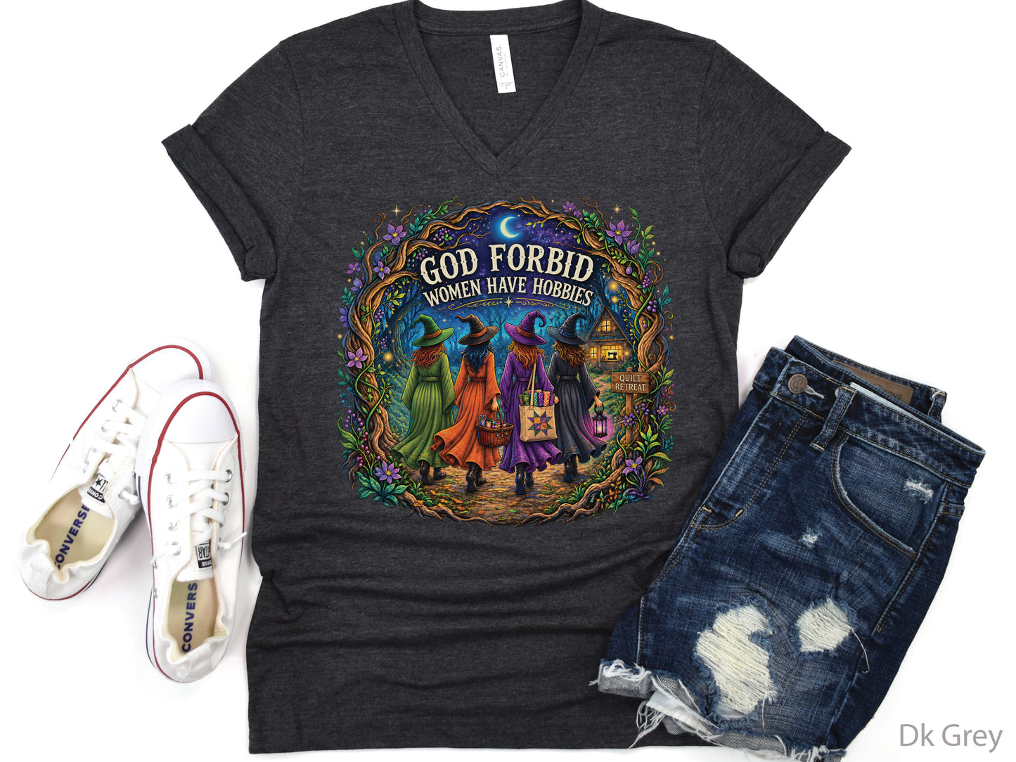 God Forbid Women Have Hobbies Halloween quilting t-shirt featuring four quilty friends dressed as witches walking through an enchanted moonlit forest to a cozy quilt retreat cottage with sewing and quilting details.