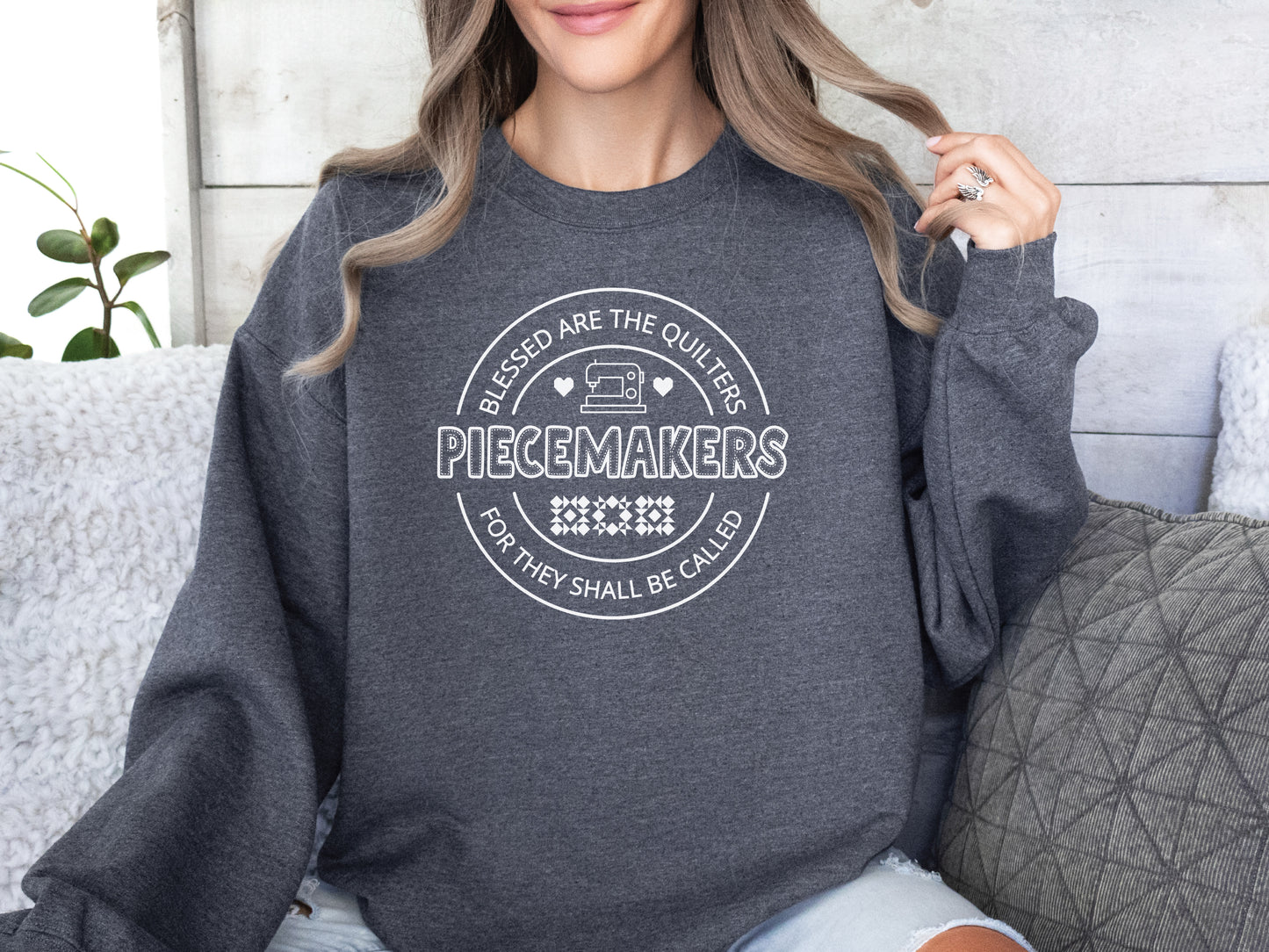 A long-sleeve quilting t-shirt from Bee Inspired Tees featuring the phrase “Piecemaker – Quilters Are Blessed,” celebrating creativity, faith, and the art of quilting; a cozy gift for quilters and perfect for retreats or sewing days.