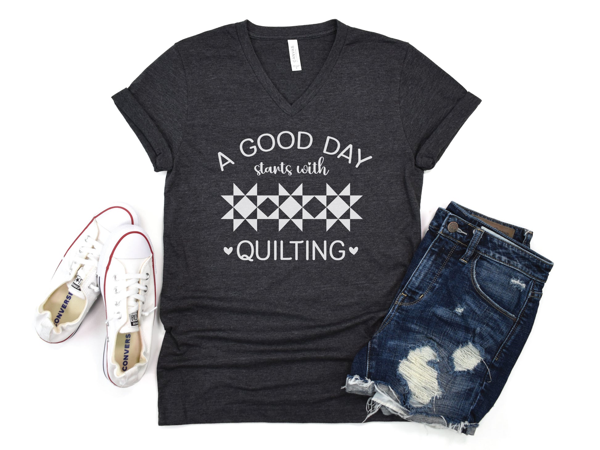 A Good Day Starts With Quilting” T-shirt on a soft heather gray V-neck — a fun gift for sewing and quilting lovers, celebrating every stitch, even with a seam ripper.