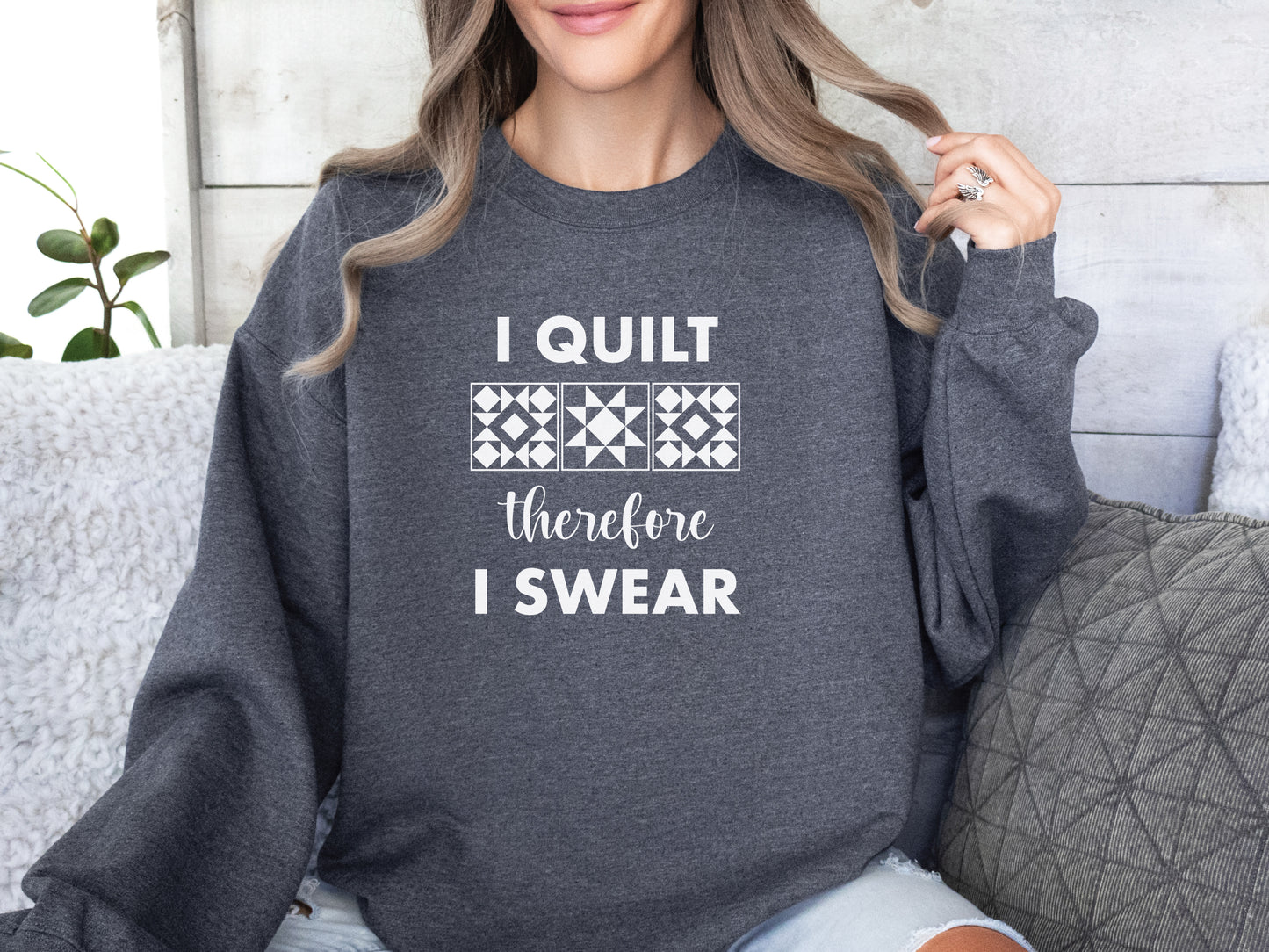 A cozy quilting sweatshirt from Bee Inspired Tees featuring the phrase “I Quilt, Therefore I Swear,” a funny and relatable gift for quilters who love to sew, laugh, and stay warm while stitching.