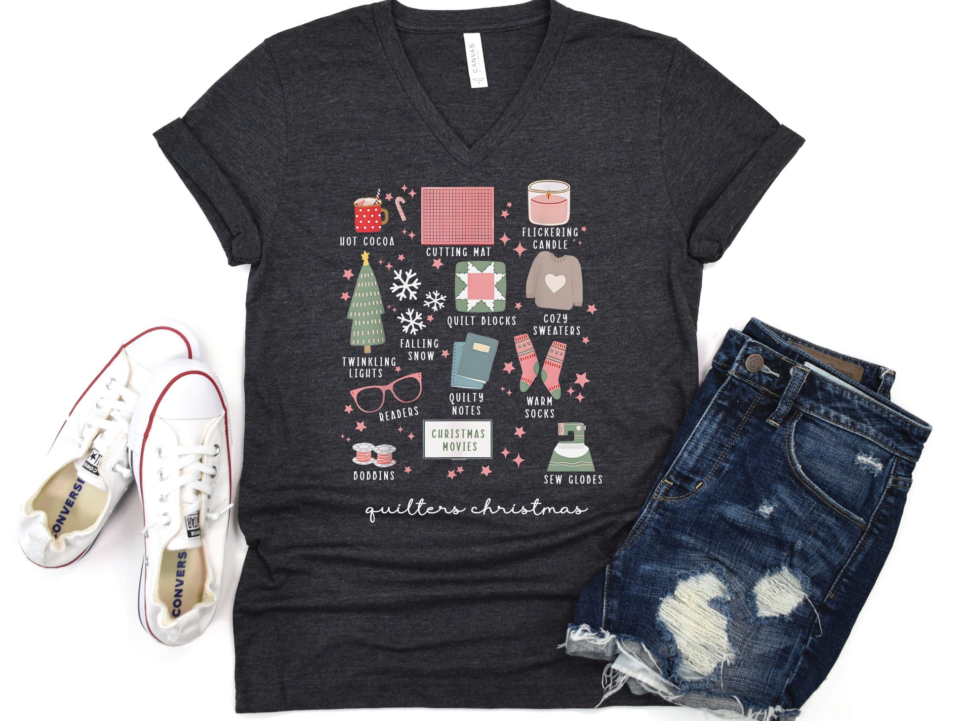 T-shirt with festive “Quilter’s Christmas” icons including quilt blocks, cocoa, lights, sweaters, and sewing items — perfect holiday gift for quilters and sewing lovers.