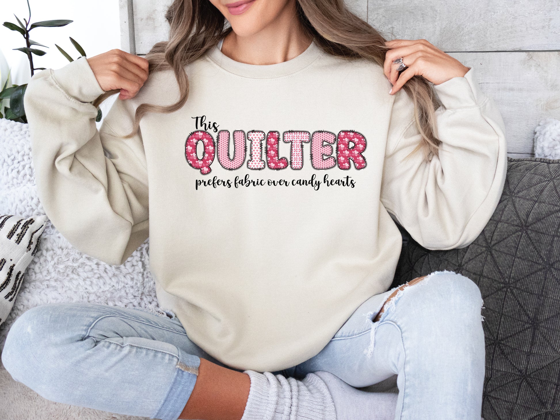 Valentine’s Day quilting t-shirt with the phrase “This Quilter Prefers Fabric Over Candy” in patchwork-style lettering, perfect for quilters.
