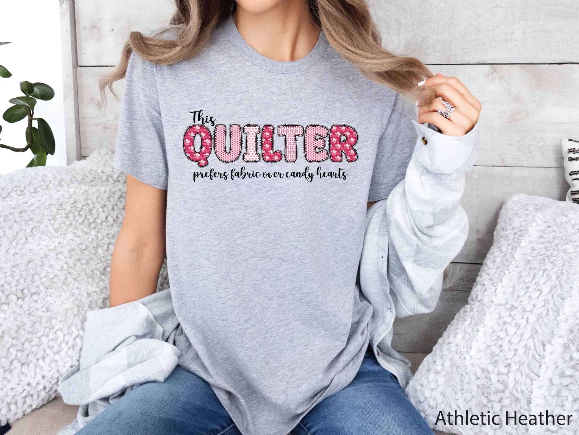 Valentine’s Day quilting t-shirt with the phrase “This Quilter Prefers Fabric Over Candy” in patchwork-style lettering, perfect for quilters.