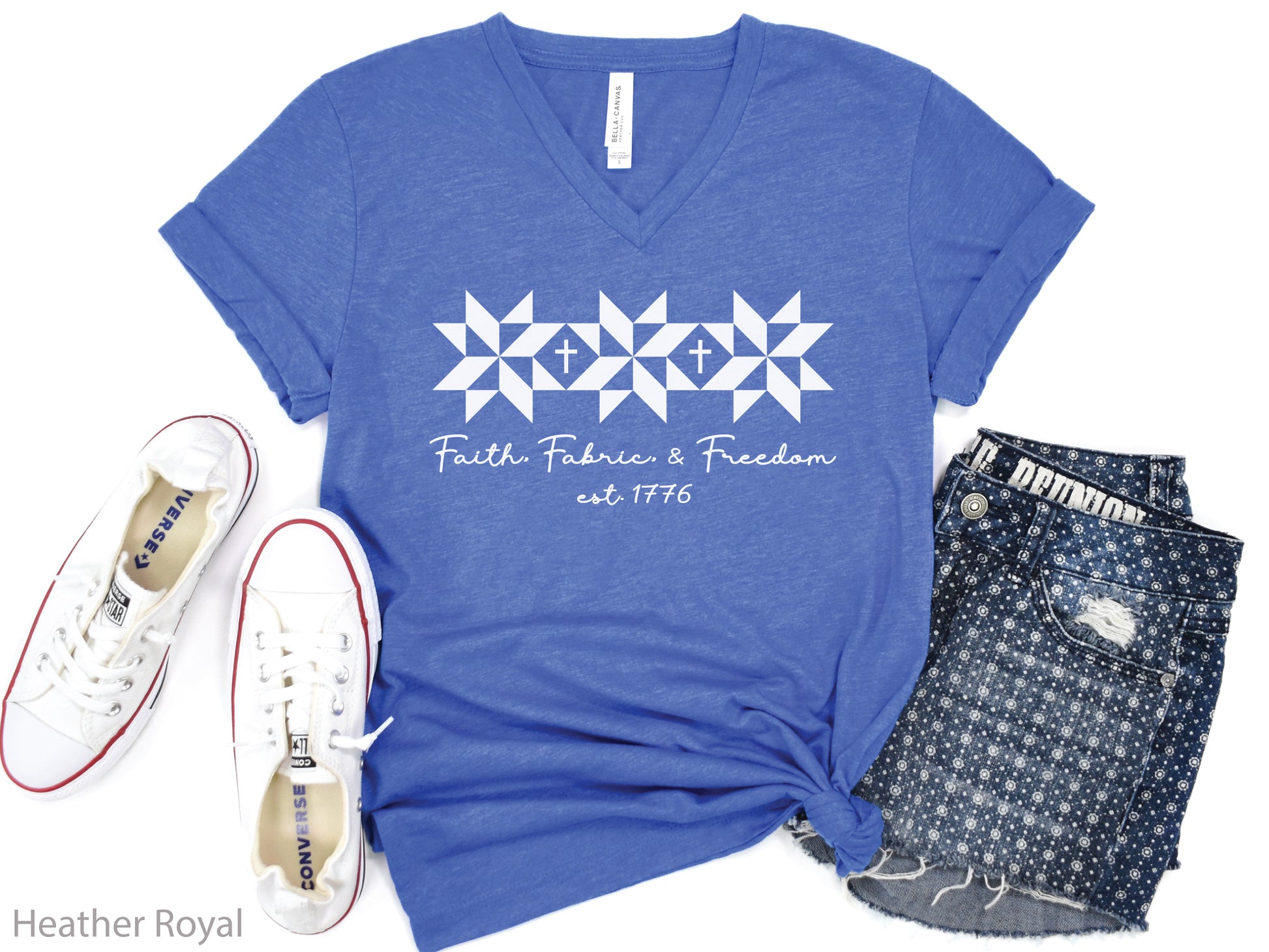 Faith, Fabric & Freedom patriotic v-neck t-shirt with quilt block stars and cross details. Perfect for quilters, sewists, and faith-based gifts.