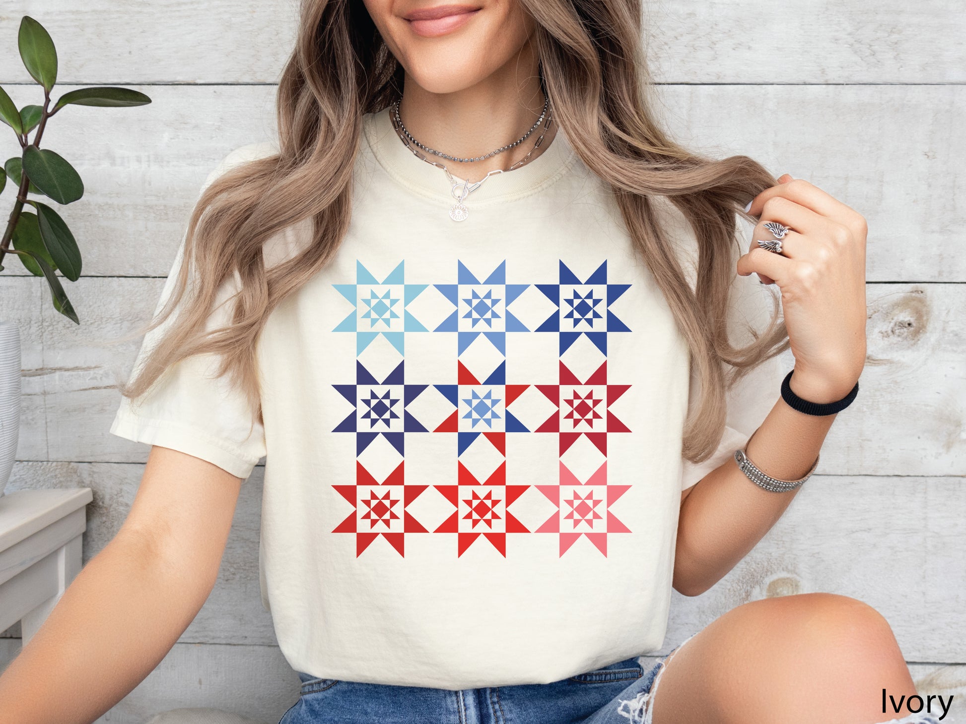 Patriotic Ombre Quilting T-Shirt featuring nine Evening Star quilt blocks arranged in a red, white, and blue ombre pattern on a Comfort Colors® shirt, celebrating America’s 250th Anniversary.