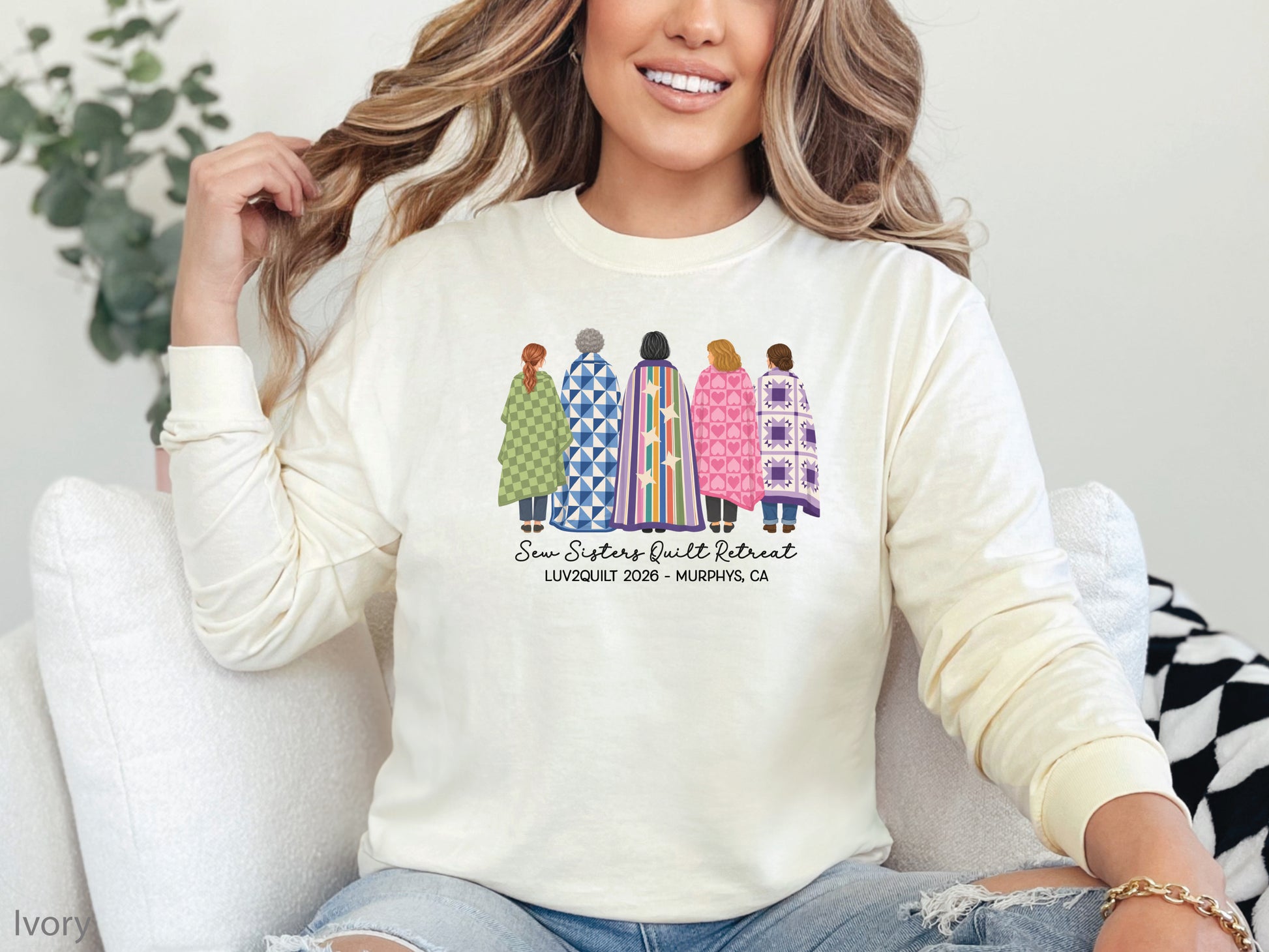 Sew Sisters Quilt Retreat long-sleeved shirt design featuring five women wrapped in colorful green, blue, striped, pink heart, and purple quilts with LUV2QUILT 2026 personalized text.