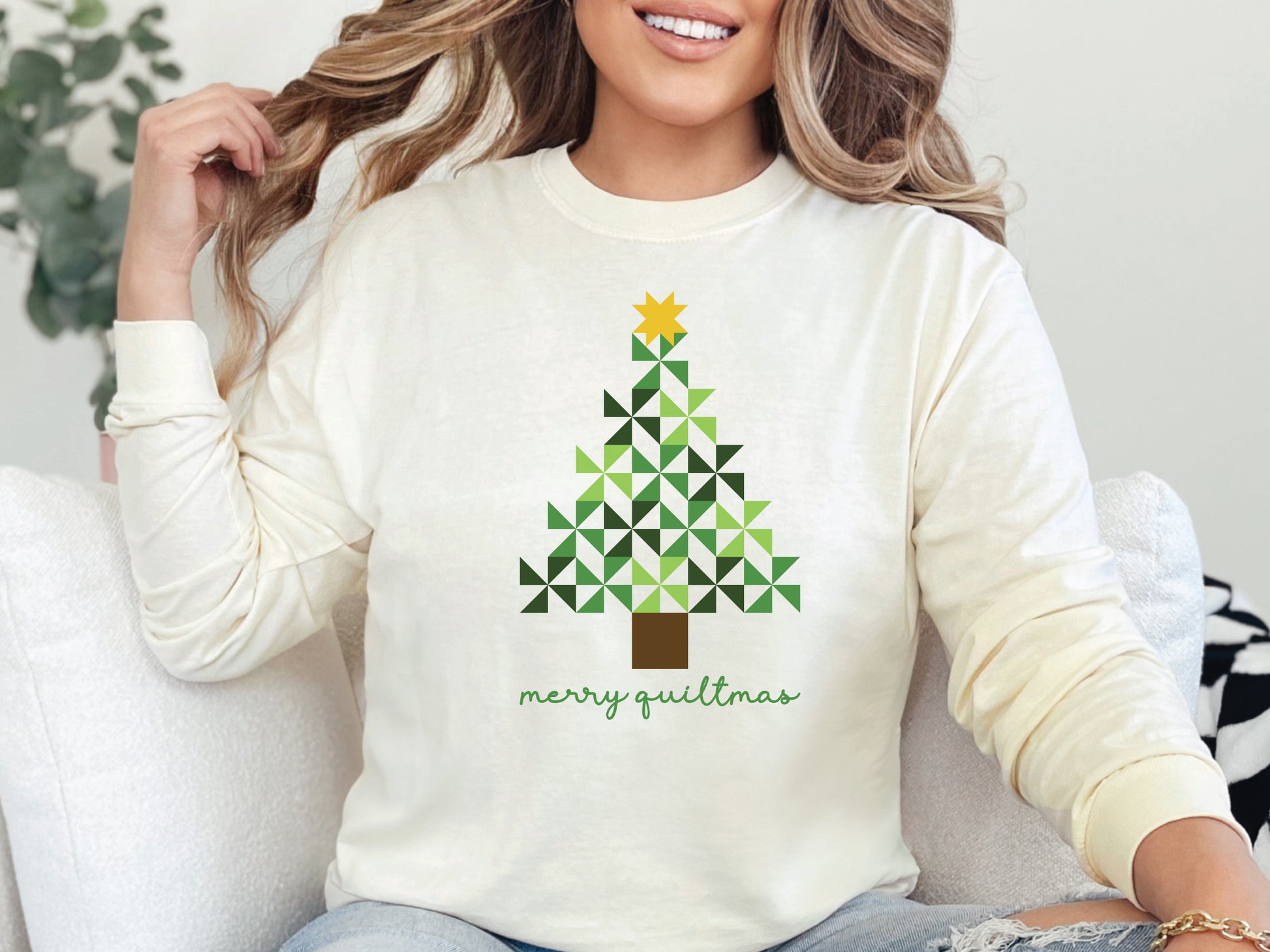 Merry Quiltmas long sleeve t-shirt in Ivory with quilt block Christmas tree design in green pinwheel blocks topped with gold star—holiday gift for quilters. Shop at Bee Inspired Tees for sewing and quilt-themed short and long sleeve t-shirts, gifts, and stickers designed for passionate sewists and quilters.