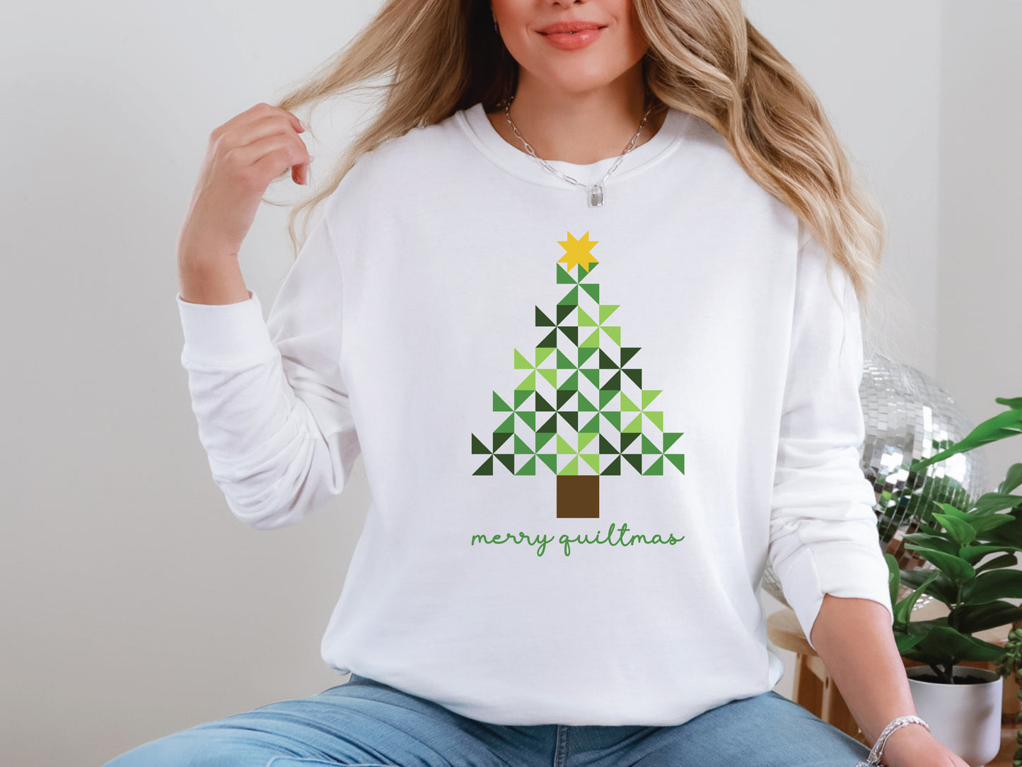 Merry Quiltmas t-shirt in White with quilt block Christmas tree design in green pinwheel blocks topped with gold star—holiday gift for quilters. Shop at Bee Inspired Tees for sewing and quilt-themed short and long sleeve t-shirts, gifts, and stickers designed for passionate sewists and quilters.