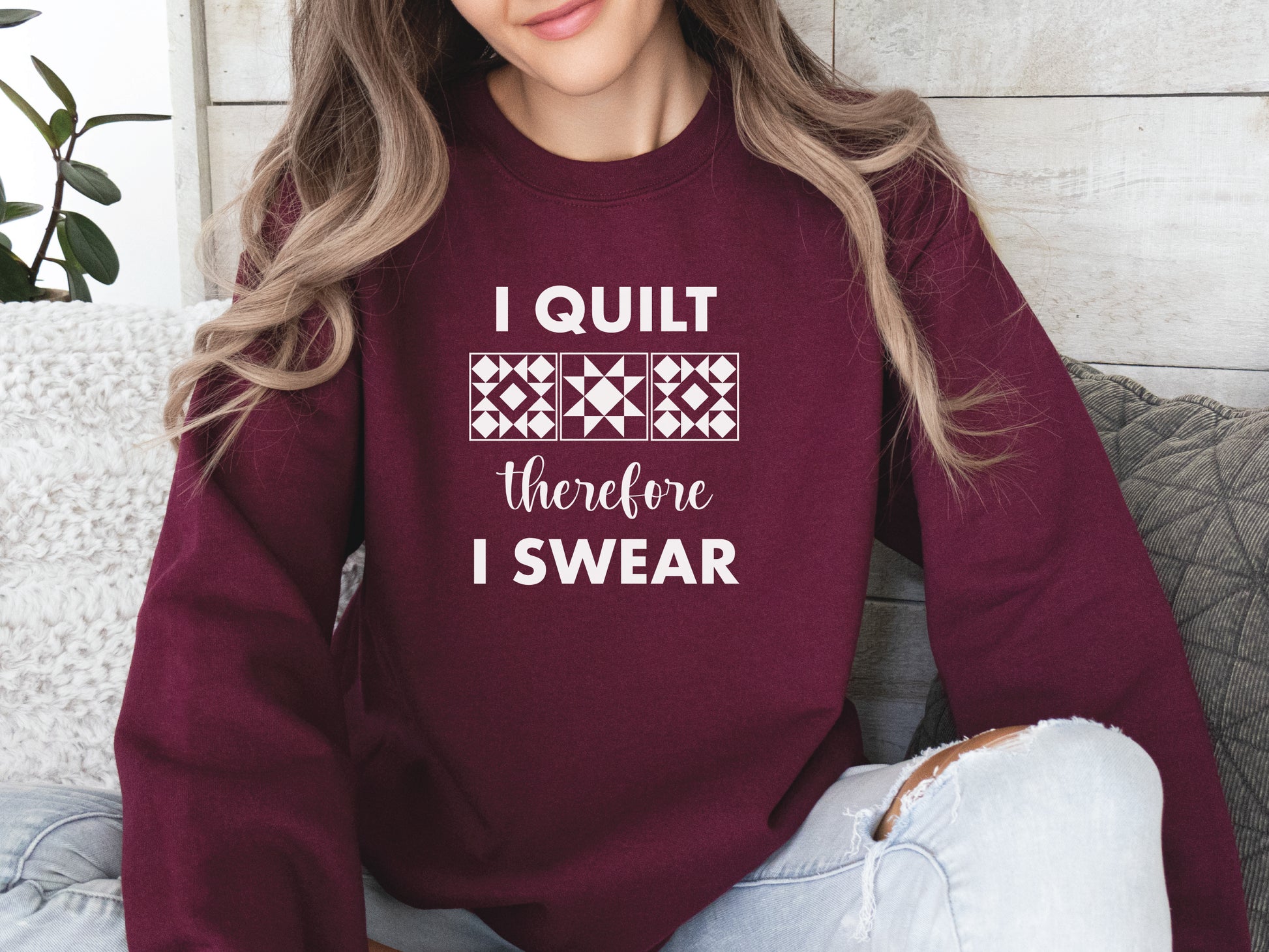 A cozy quilting sweatshirt from Bee Inspired Tees featuring the phrase “I Quilt, Therefore I Swear,” a funny and relatable gift for quilters who love to sew, laugh, and stay warm while stitching.
