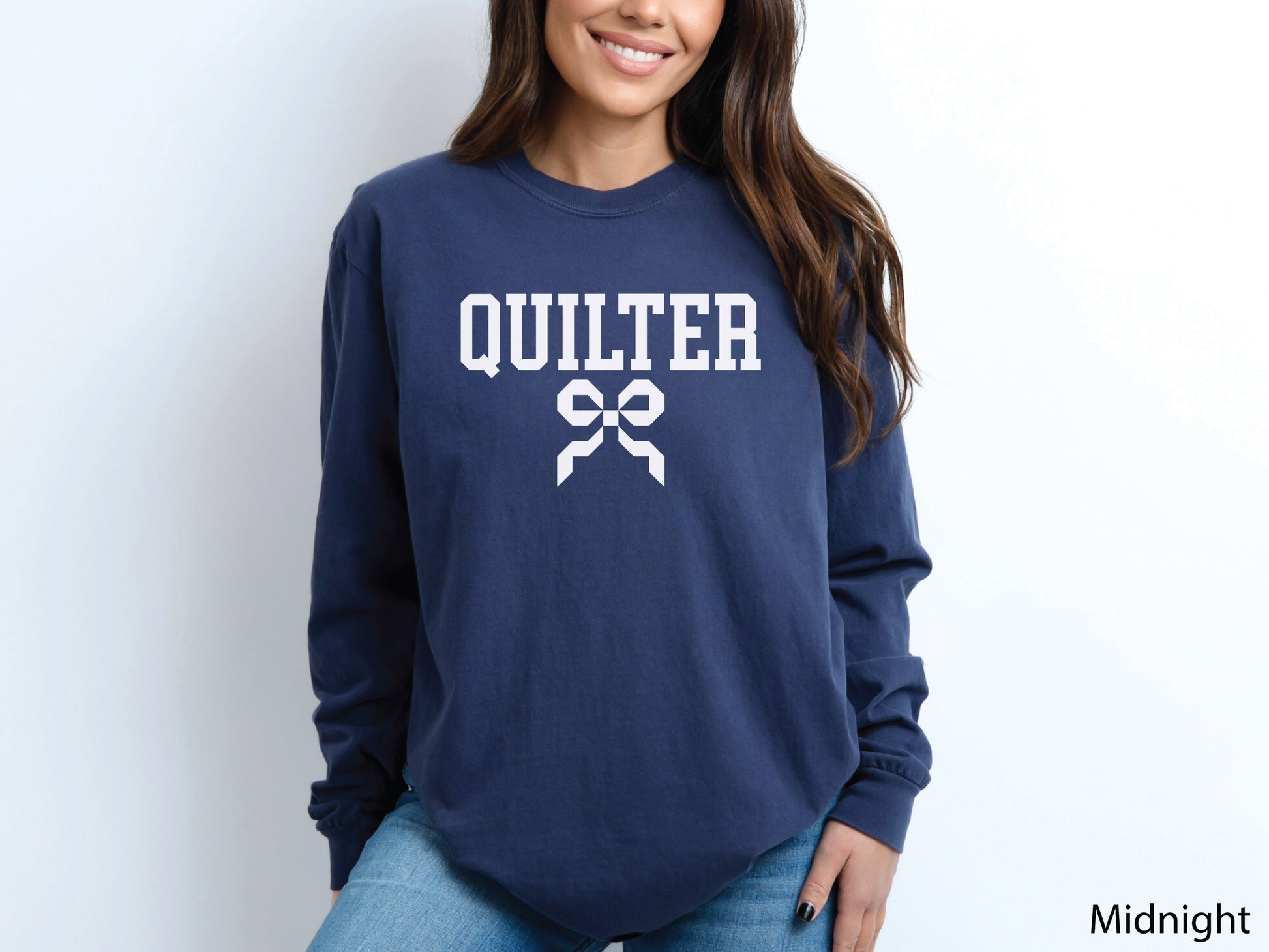 Cozy sweatshirt with bold varsity-style “Quilter” lettering and a coquette bow — perfect for quilt retreats, guild meetings, or as a thoughtful gift for quilters.