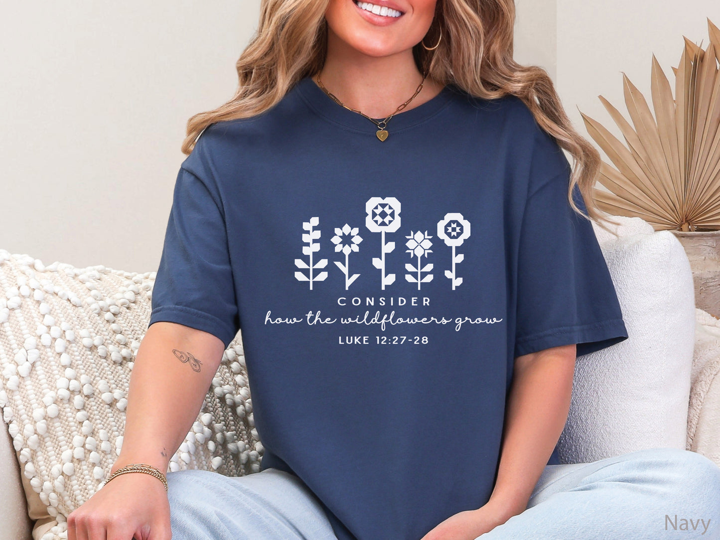 Quilt-inspired wildflower design t-shirt featuring Bible verse Luke 12:27–28, perfect for quilters and faith-based apparel.