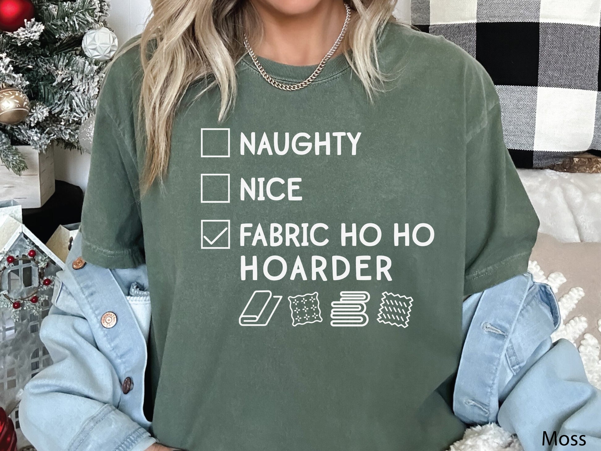 Funny Christmas t-shirt with a “Fabric Ho Ho Hoarder” checklist design — festive holiday shirt for quilters, sewists, and fabric lovers.