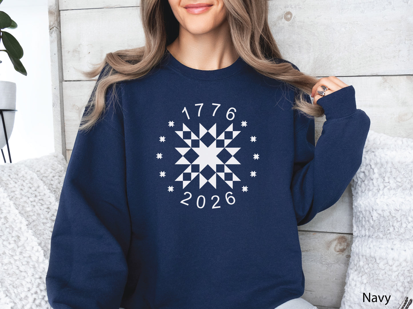 Patriotic quilting sweatshirt featuring a white star quilt block with surrounding stars and the years 1776–2026, celebrating America’s 250th Anniversary. Makes a great valor quilter gift.