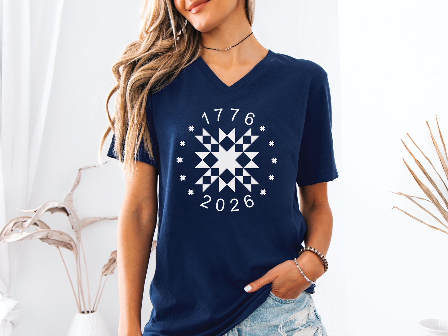 Patriotic quilting t-shirt in navy featuring a white star quilt block with surrounding stars and the years 1776–2026, celebrating America’s 250th Anniversary.
