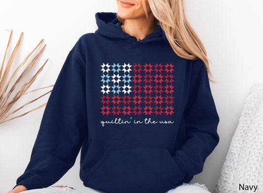 Quiltin’ In The USA quilt hoodie sweatshirt with red, white, and blue quilt block design, ideal for America’s 250th Anniversary and patriotic quilters.