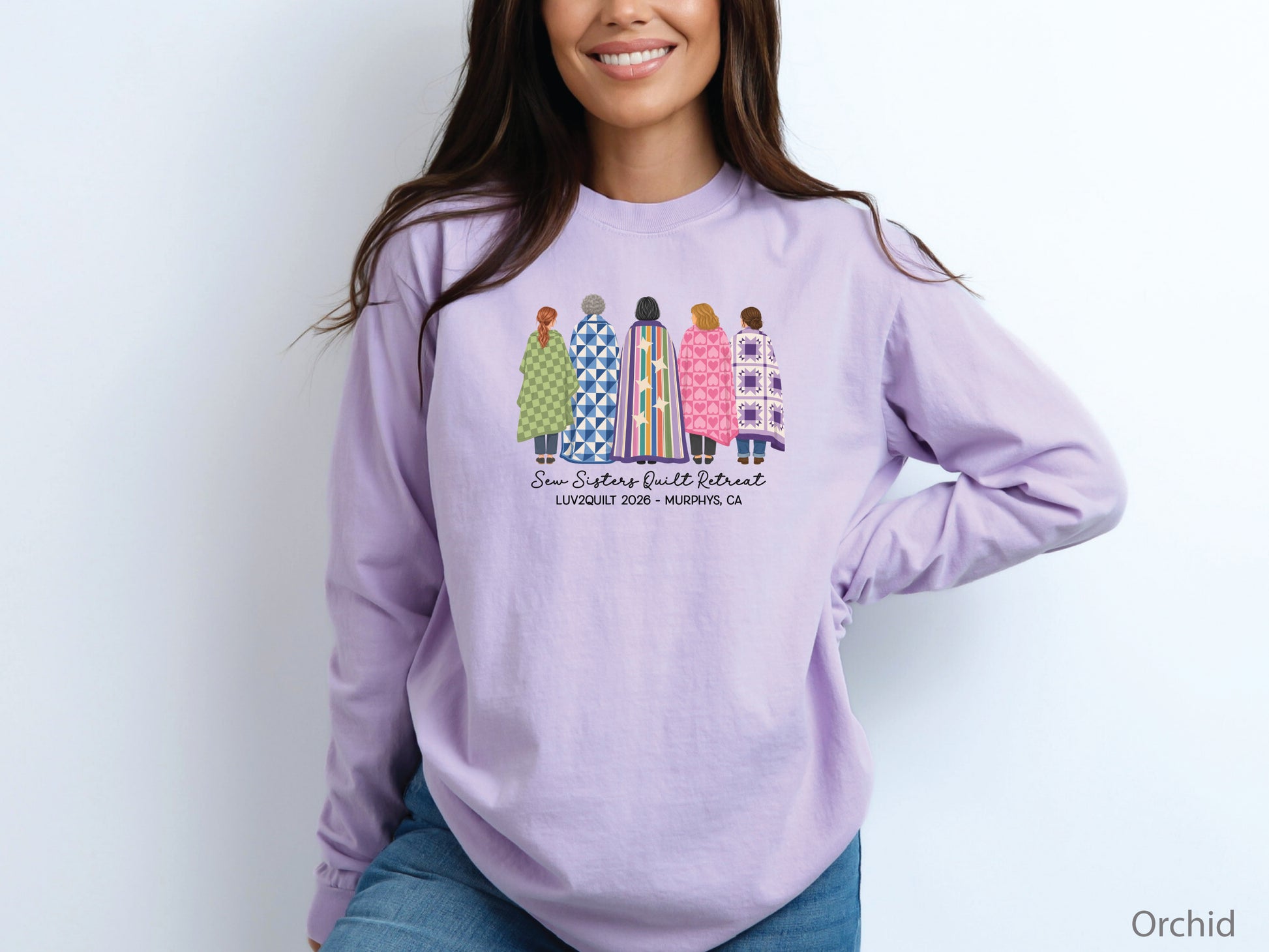 Sew Sisters Quilt Retreat long-sleeved shirt design featuring five women wrapped in colorful green, blue, striped, pink heart, and purple quilts with LUV2QUILT 2026 personalized text.