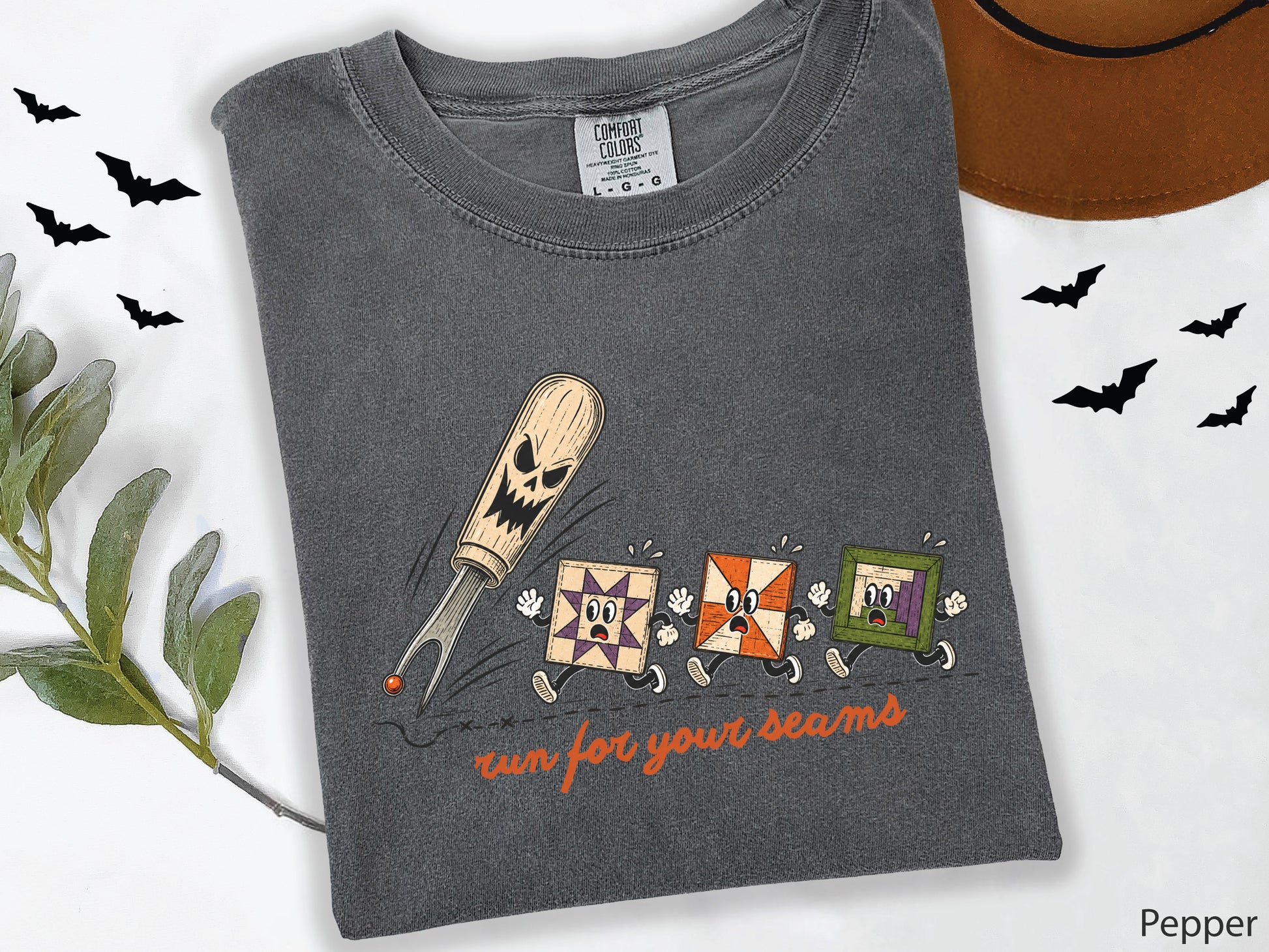 Run for Your Seams Halloween quilting design featuring a spooky seam ripper chasing three frightened colorful quilt blocks in a vintage-inspired style.