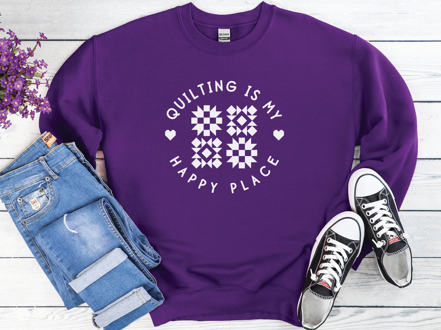 Cozy unisex sweatshirt with the phrase “Quilting Is My Happy Place” printed on the front — perfect for quilters and sewists who love to create.