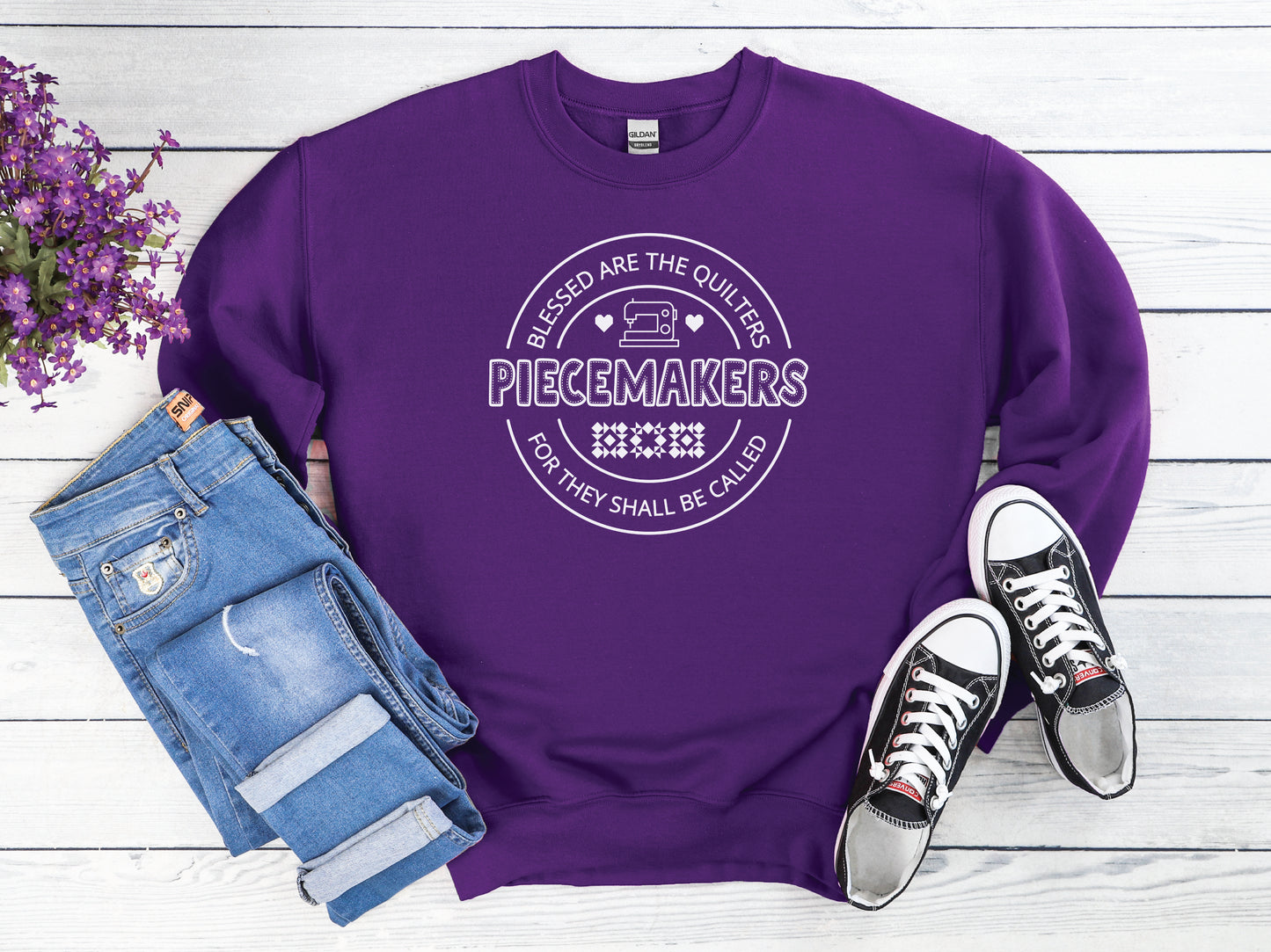 A long-sleeve quilting t-shirt from Bee Inspired Tees featuring the phrase “Piecemaker – Quilters Are Blessed,” celebrating creativity, faith, and the art of quilting; a cozy gift for quilters and perfect for retreats or sewing days.
