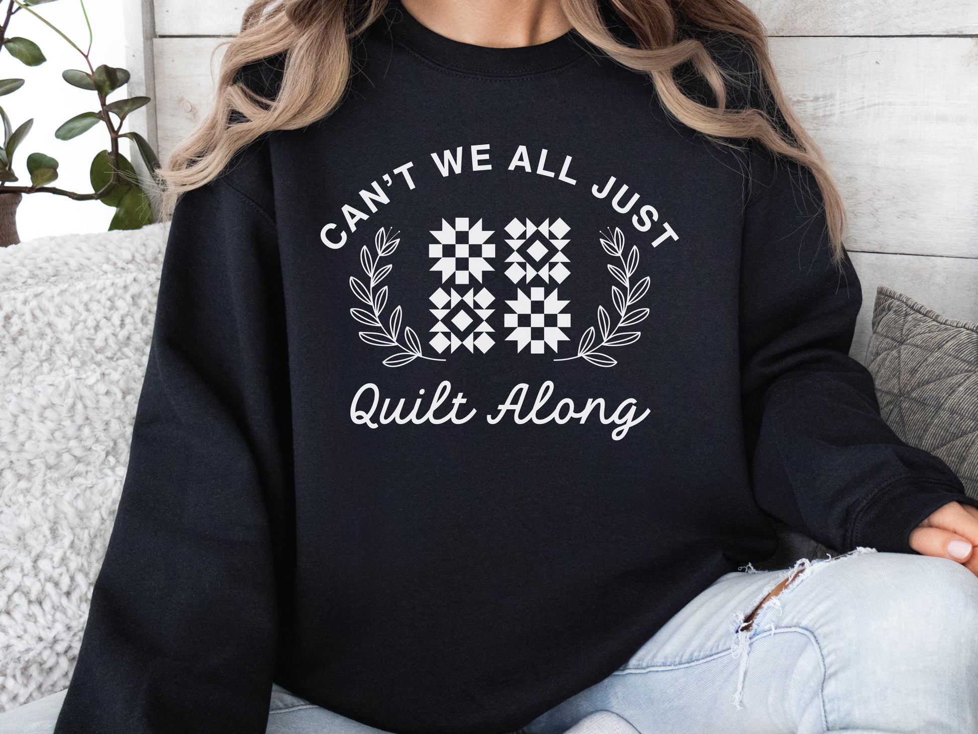 Cozy quilt-themed soft crew Black sweatshirt with the phrase “Can’t We Just All Quilt Along,” perfect gift for a quilter, ideal for sewing days, quilt retreats, and craft fairs.