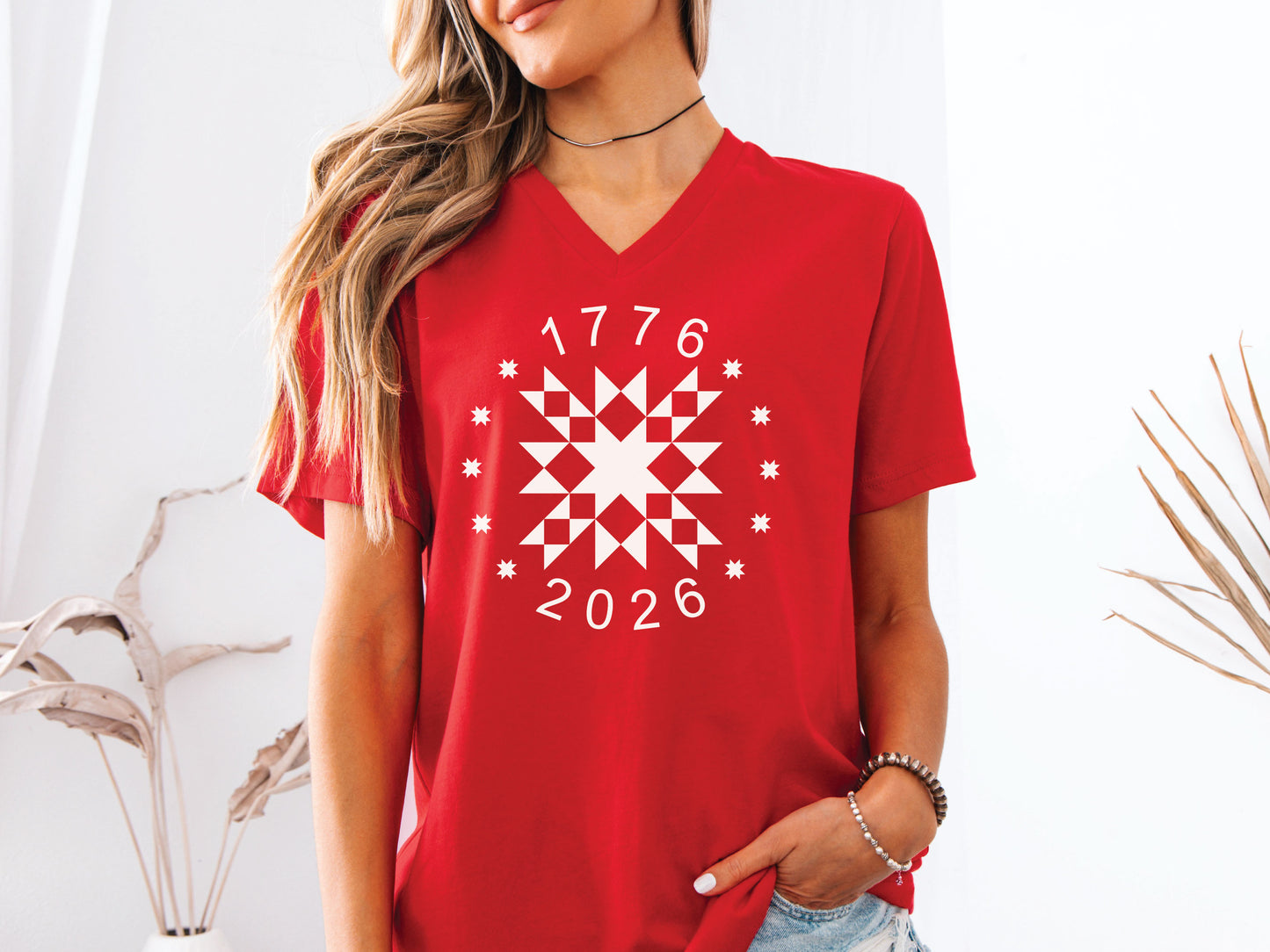 Patriotic quilting t-shirt in navy featuring a white star quilt block with surrounding stars and the years 1776–2026, celebrating America’s 250th Anniversary.