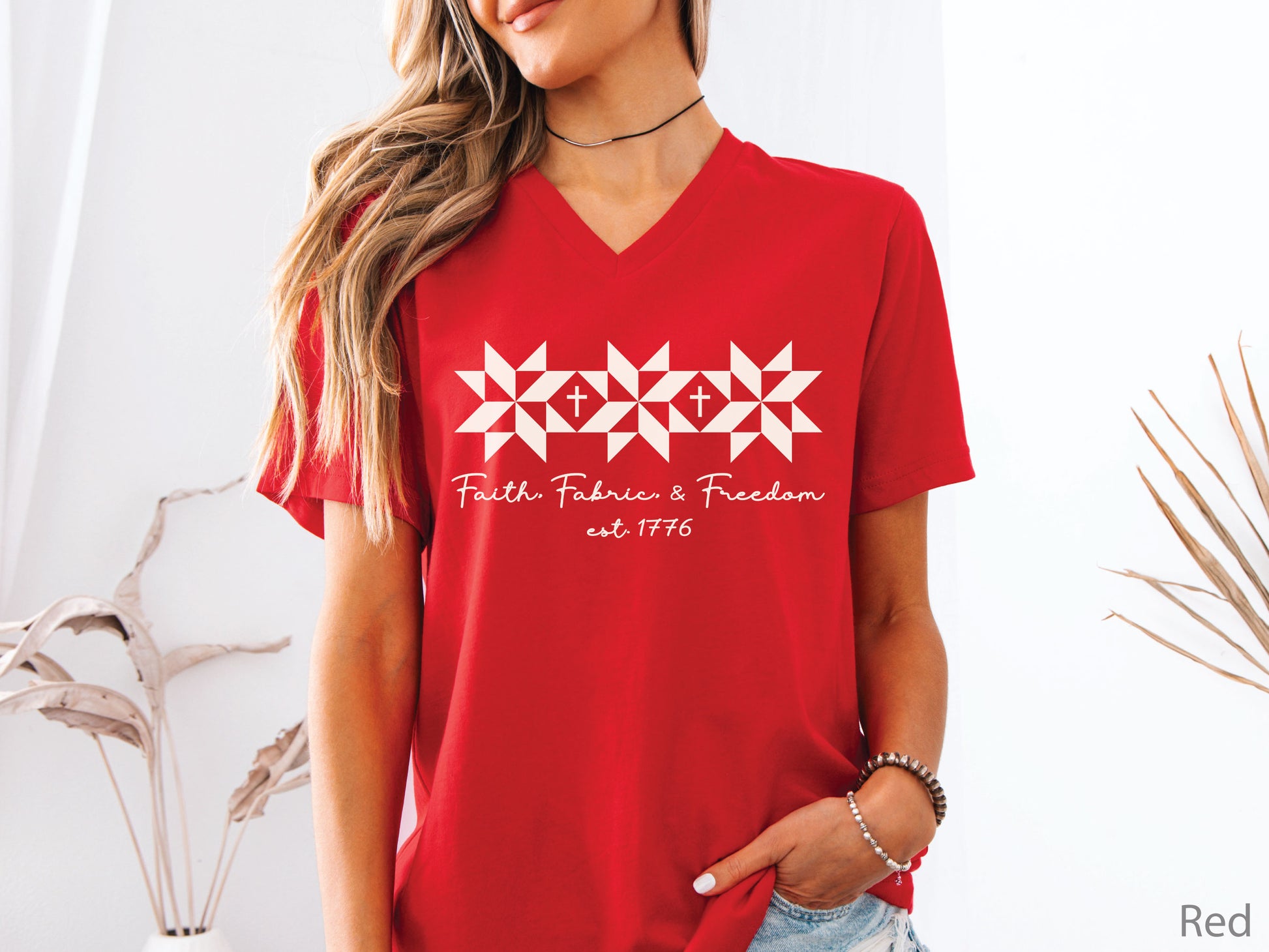 Faith, Fabric & Freedom patriotic v-neck t-shirt with quilt block stars and cross details. Perfect for quilters, sewists, and faith-based gifts.