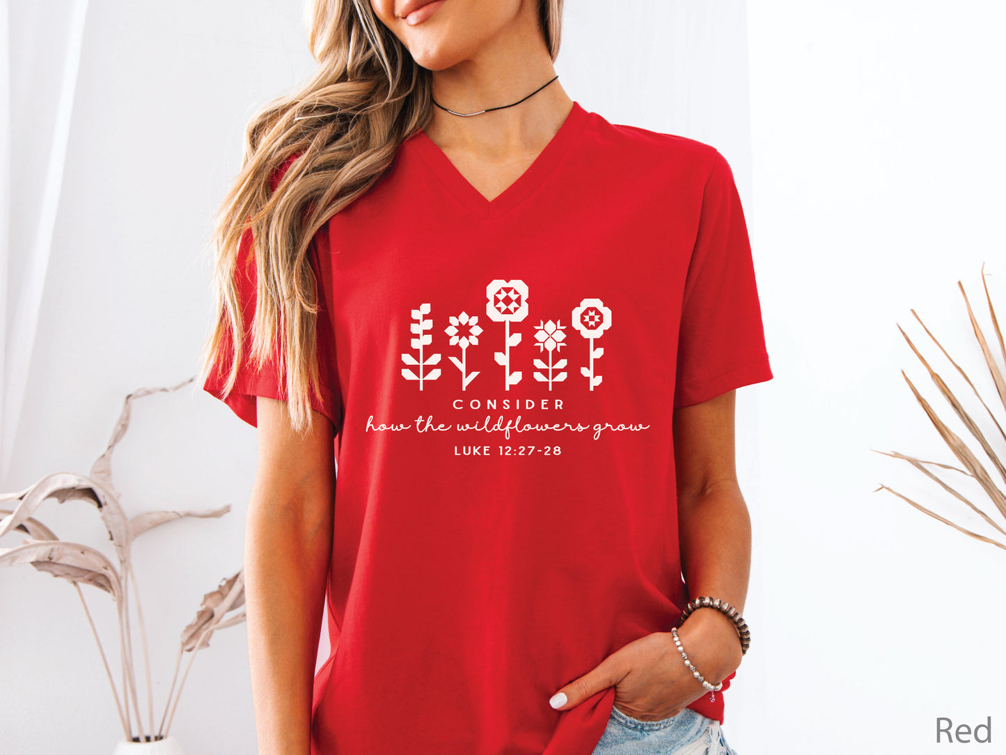Quilt-inspired wildflower design t-shirt featuring Bible verse Luke 12:27–28, perfect for quilters and faith-based apparel.
