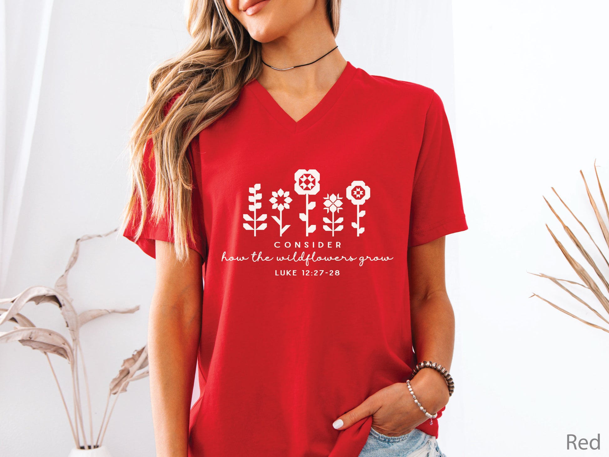 Quilt-inspired wildflower design t-shirt featuring Bible verse Luke 12:27–28, perfect for quilters and faith-based apparel.
