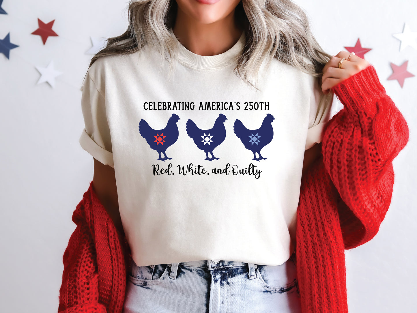Patriotic quilting t-shirt with three chickens featuring red, white, and blue quilt star blocks and the phrase “Celebrating America’s 250th – Red, White, and Quilty.”
