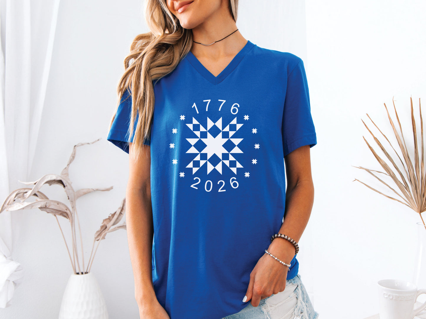 Patriotic quilting t-shirt in navy featuring a white star quilt block with surrounding stars and the years 1776–2026, celebrating America’s 250th Anniversary.